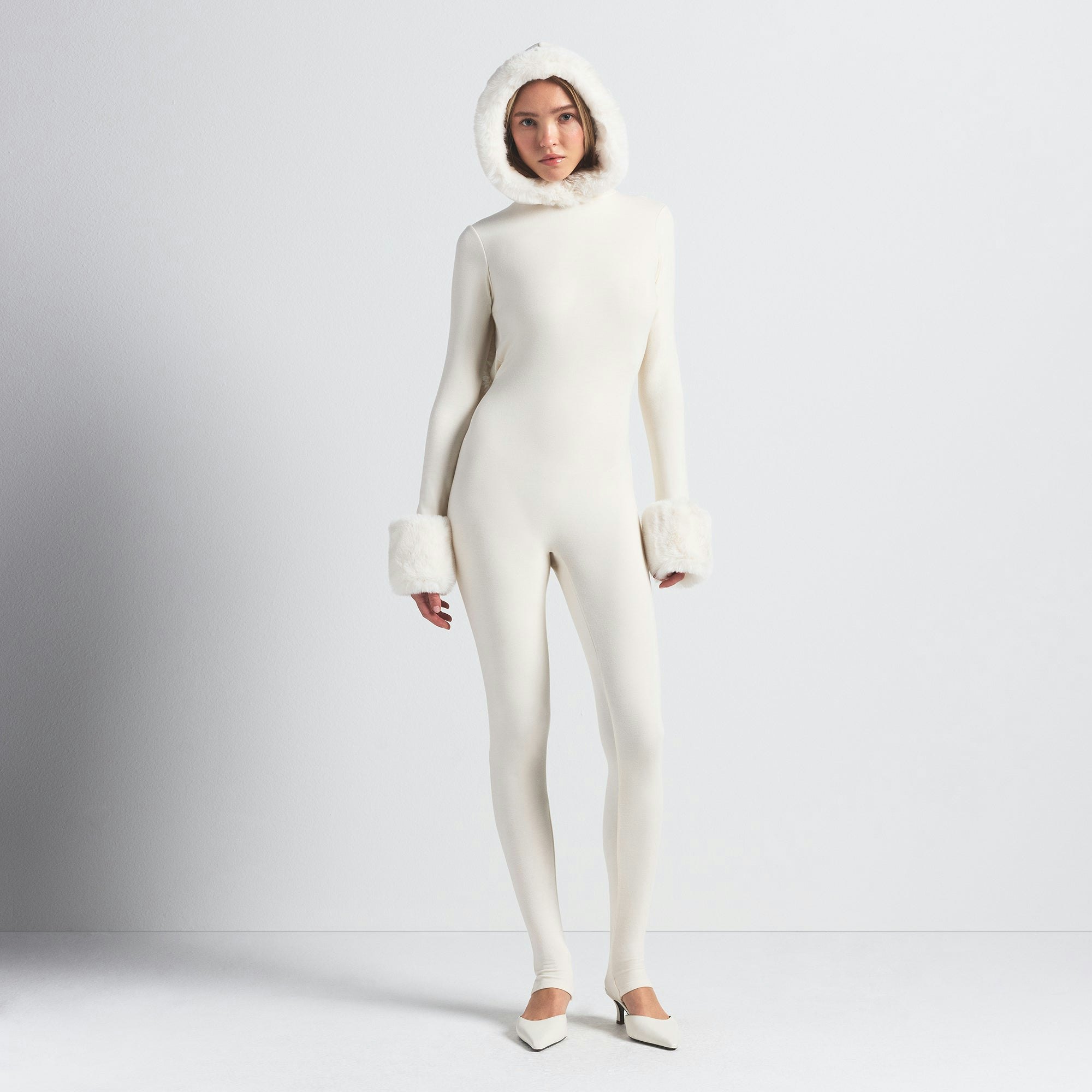SKIMS CLOUD HOODED CATSUIT | ECRU ON A MODEL FRONT VIEW @ | FOCUS: 0.0, 1.0, 0.9