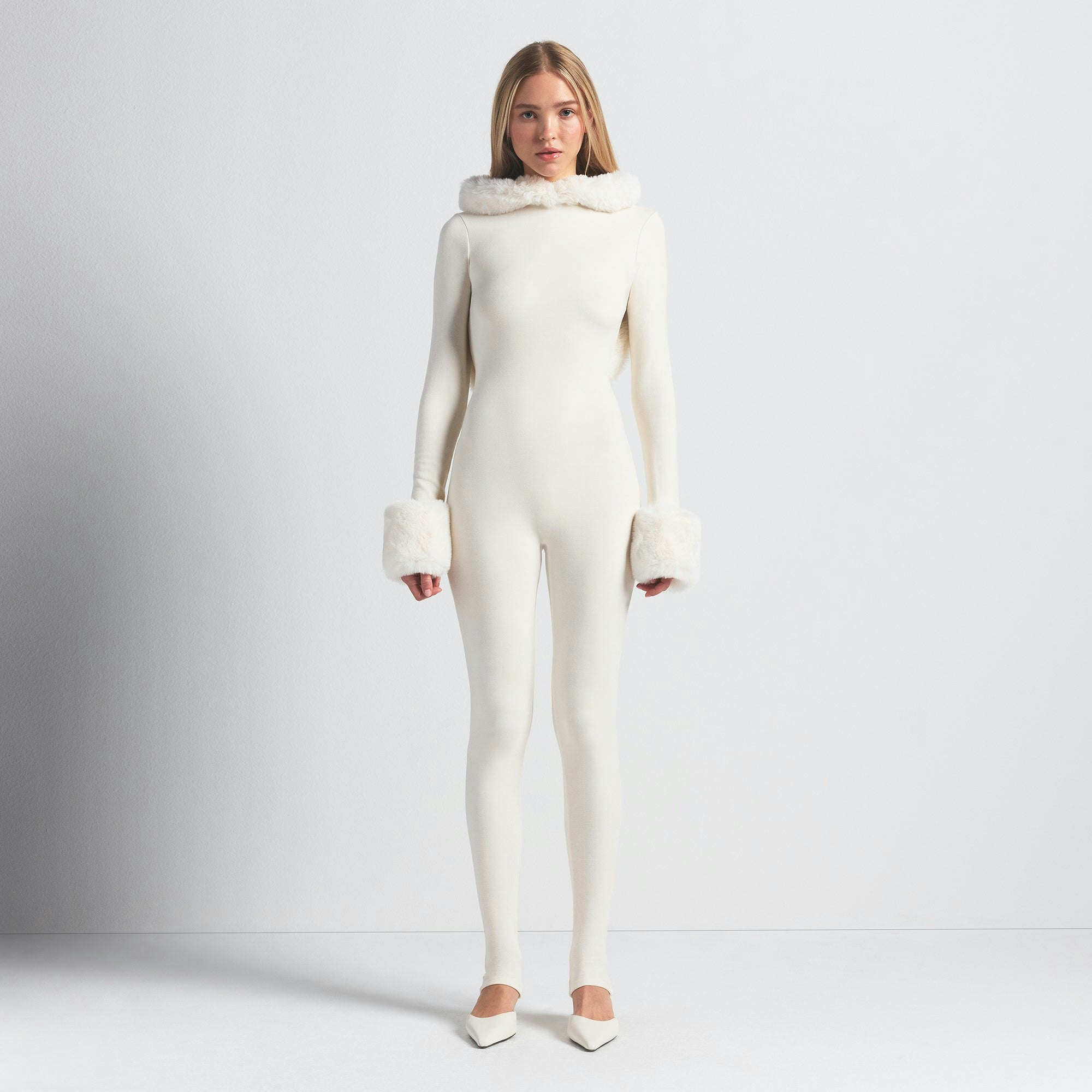 SKIMS CLOUD HOODED CATSUIT | ECRU ON A MODEL FRONT VIEW @ | FOCUS: 0.0, 1.0, 0.9