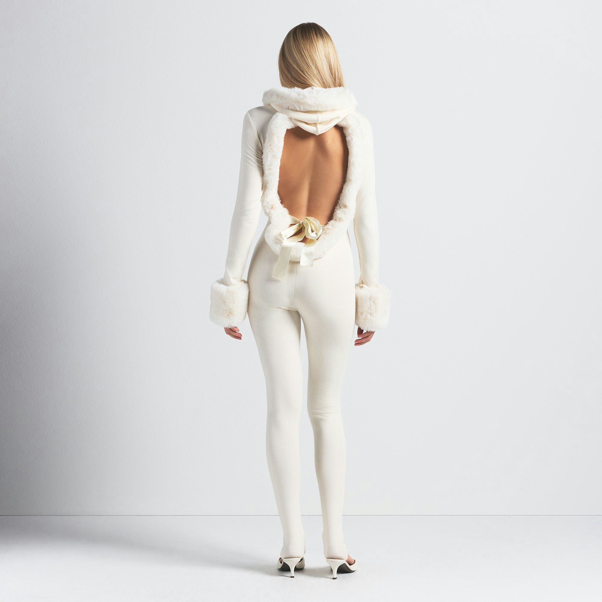 SKIMS CLOUD HOODED CATSUIT | ECRU ON A MODEL BACK VIEW @ | FOCUS: 0.0, 1.0, 0.9