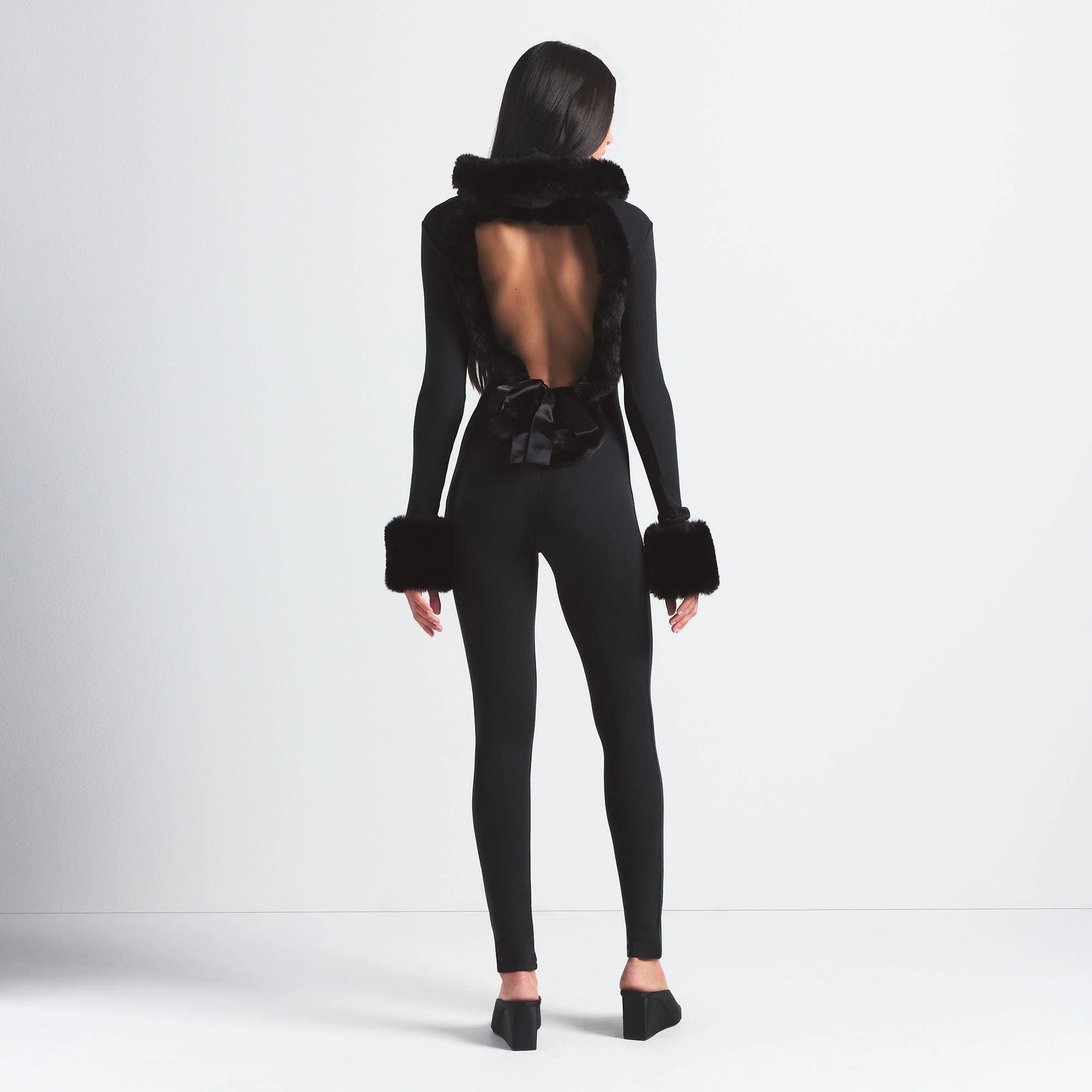 SKIMS CLOUD HOODED CATSUIT | ONYX ON A MODEL BACK VIEW @ | FOCUS: 0.0, 1.0, 0.9
