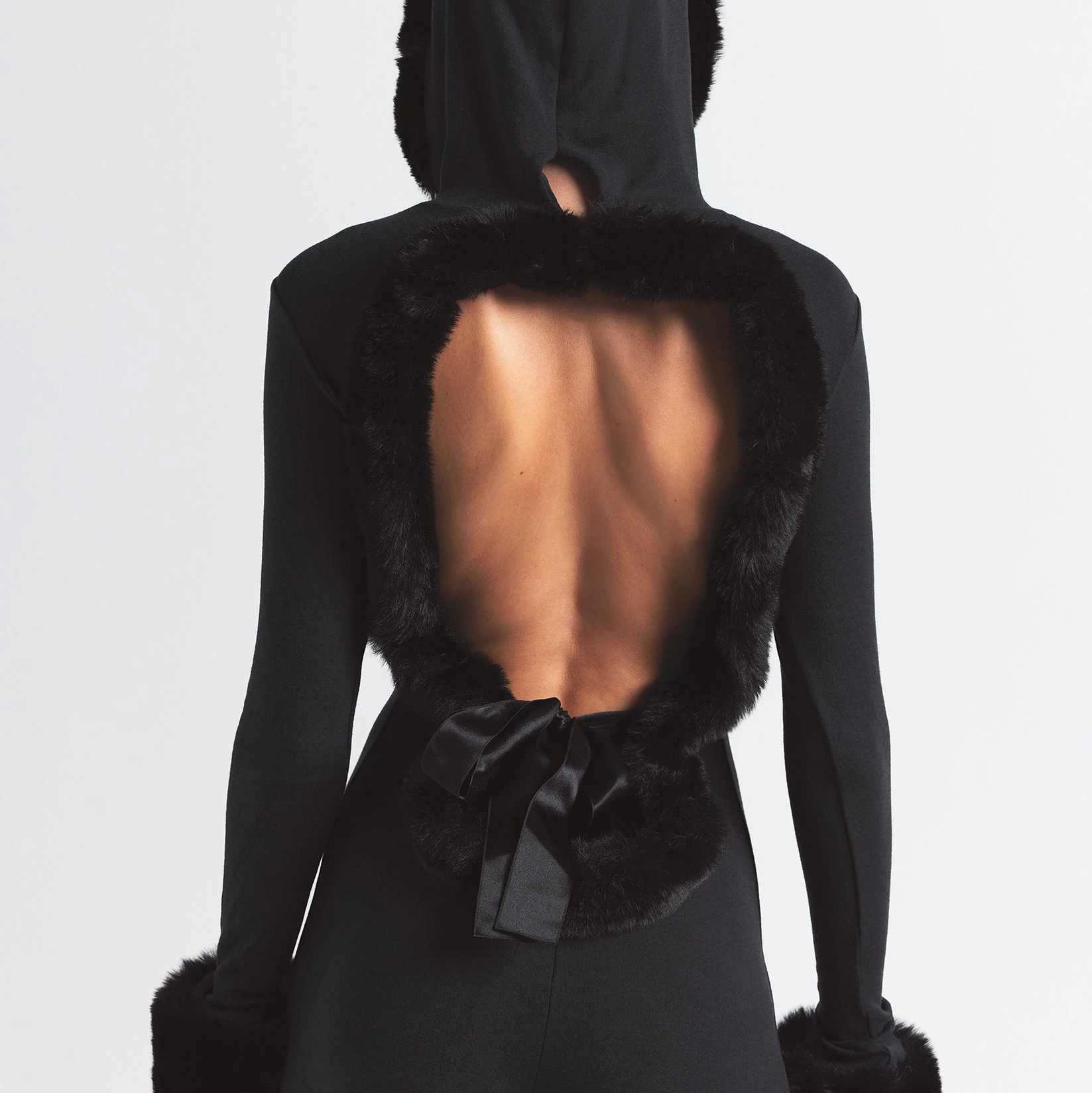 SKIMS CLOUD HOODED CATSUIT | ONYX ON A MODEL BACK VIEW @ | FOCUS: 0.0, 1.0, 0.9