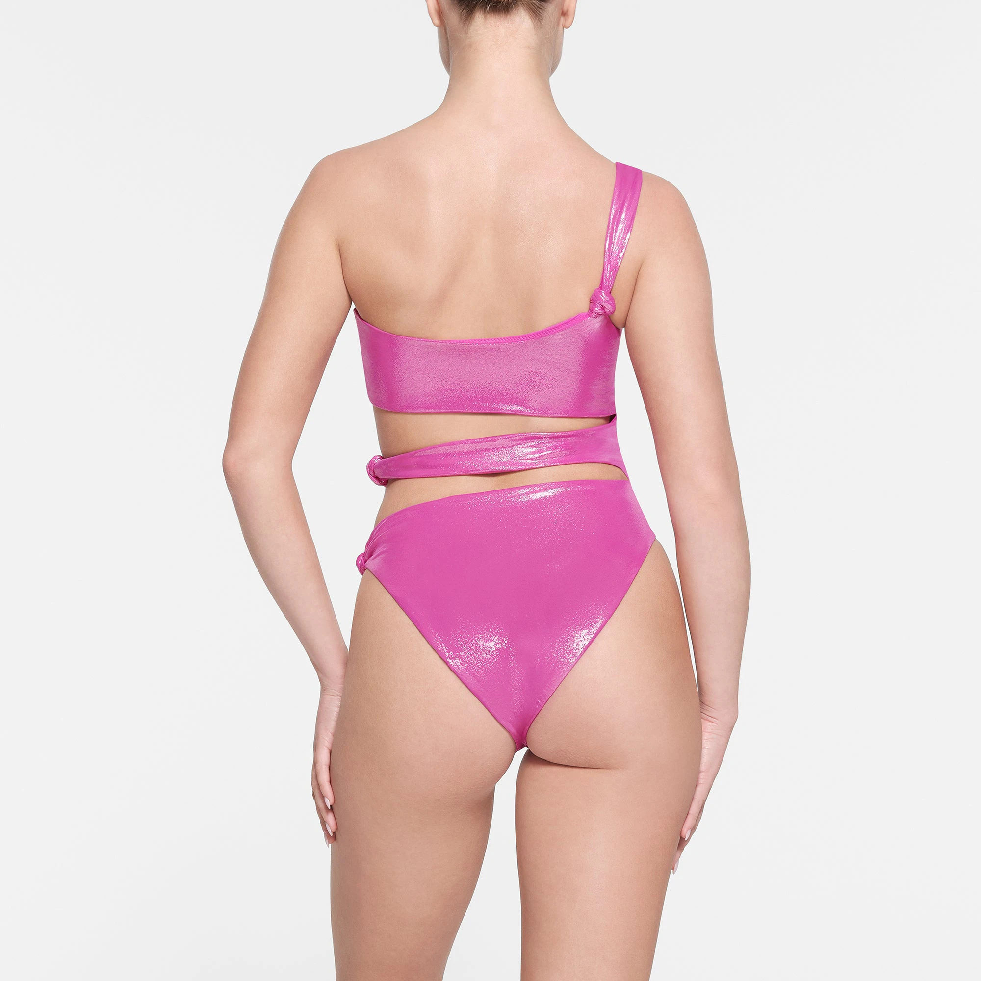 LIQUID SHINE SWIM KNOTTED ONE SHOULDER MONOKINI | LOLLIPOP ON A MODEL BACK VIEW