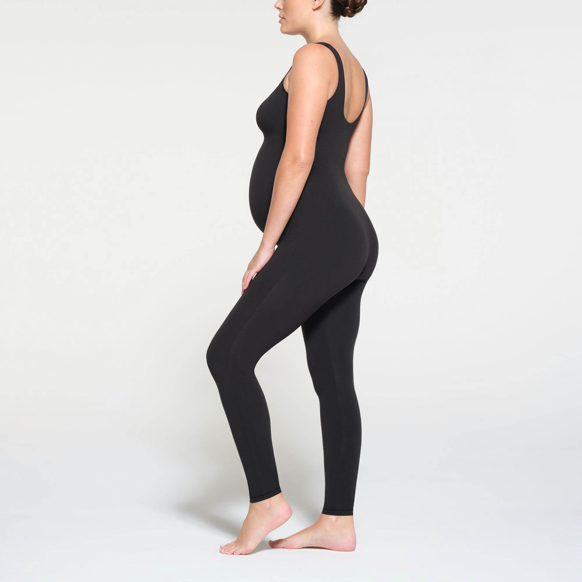 FITS EVERYBODY MATERNITY CATSUIT | ONYX ON A MODEL SIDE VIEW