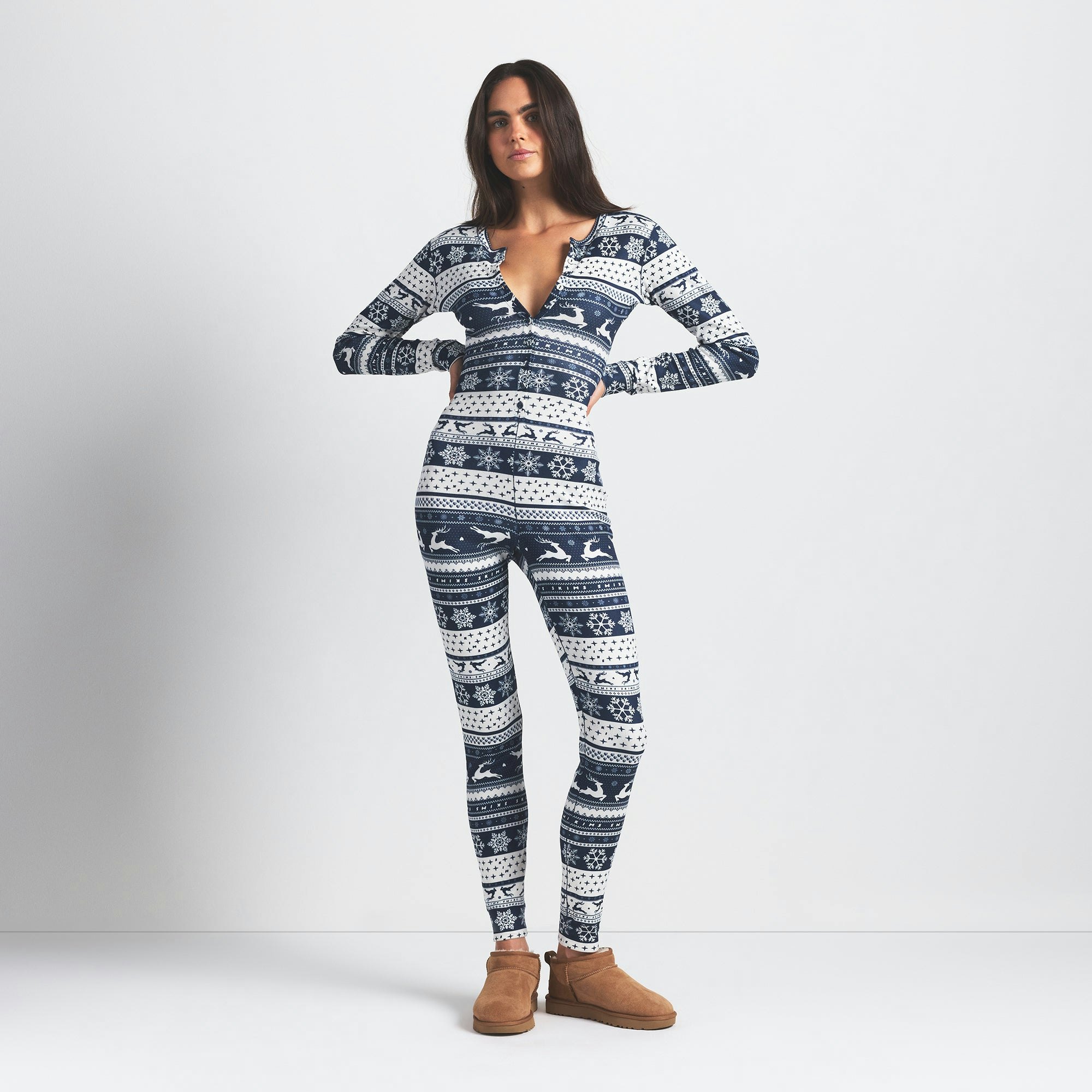 LOGO PLUSH POINTELLE HENLEY ONESIE | NAVY DEER FAIR ISLE ON A MODEL FRONT VIEW @ | FOCUS: 0.0, 1.0, 0.9