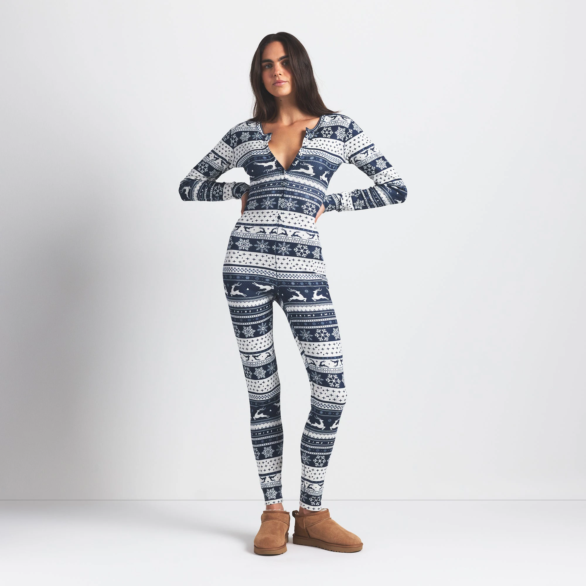 LOGO PLUSH POINTELLE HENLEY ONESIE | NAVY DEER FAIR ISLE ON A MODEL FRONT VIEW @ | FOCUS: 0.0, 1.0, 0.9