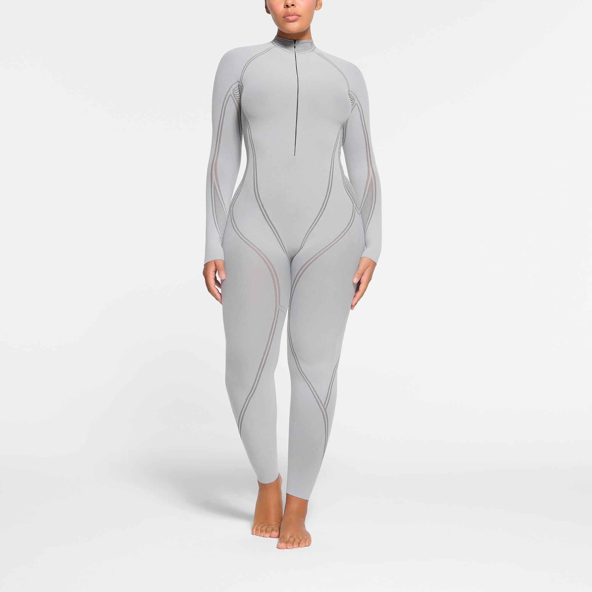 SKIMS FIRST LAYERS ZIP FRONT CATSUIT | MIRROR ON A MODEL FRONT VIEW