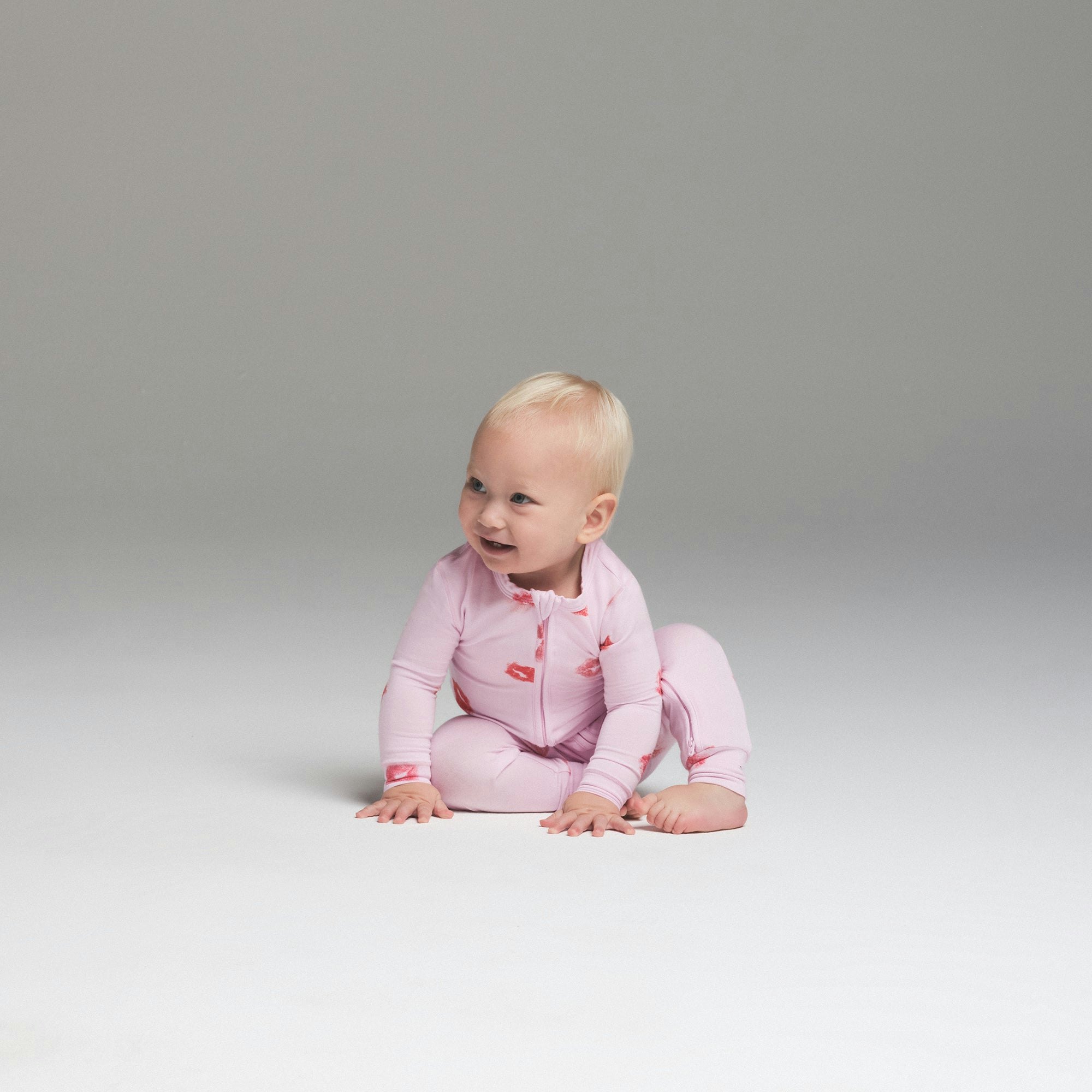 SKIMS SLEEP BABY ONESIE | CHERRY BLOSSOM LIPSTICK ON A MODEL FRONT VIEW | FOCUS: 0.0, 1.0, 0.9