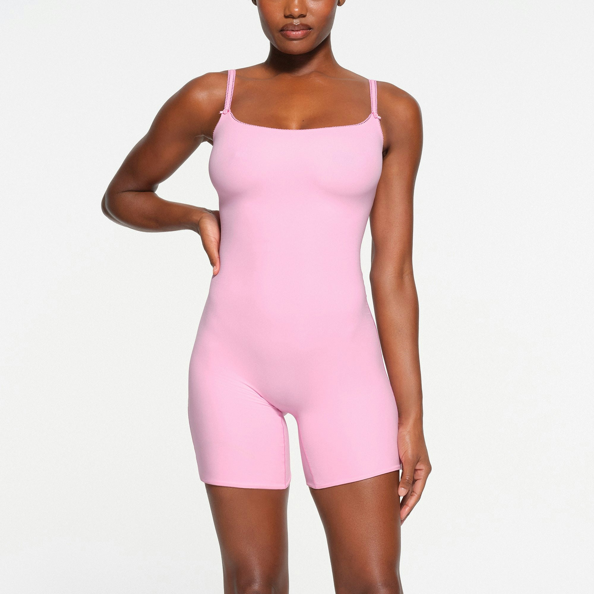 FITS EVERYBODY PICOT TRIM ONESIE | BUBBLE GUM ON A MODEL FRONT VIEW