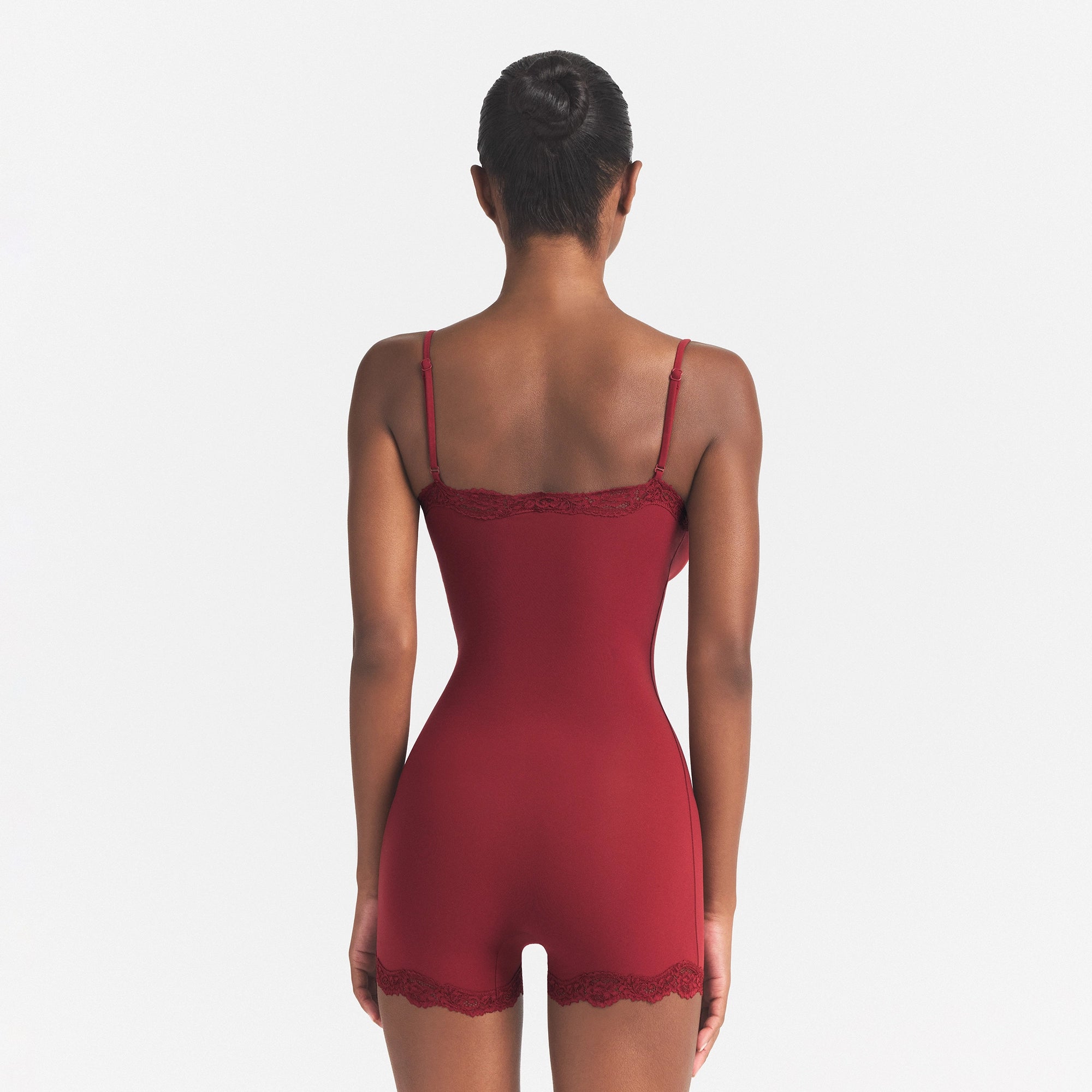 FITS EVERYBODY LACE ONESIE | MERLOT ON A MODEL SIDE VIEW