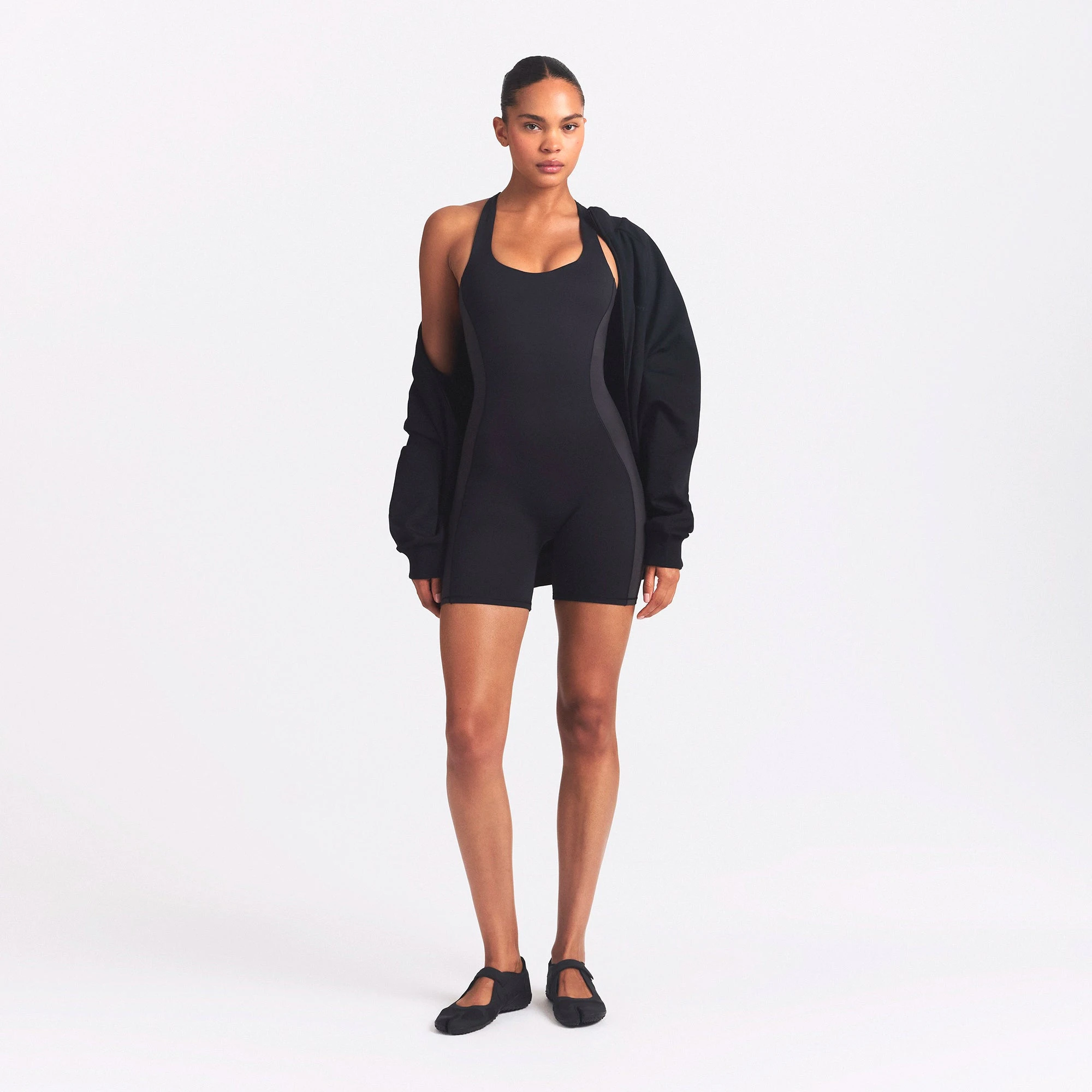 NikeSKIMS MATTE AND SHINE RACERBACK 5" ONE PIECE | OBSIDIAN/IGNEOUS ON A MODEL FRONT VIEW @ | FOCUS: 0.0, 1.0, 0.9