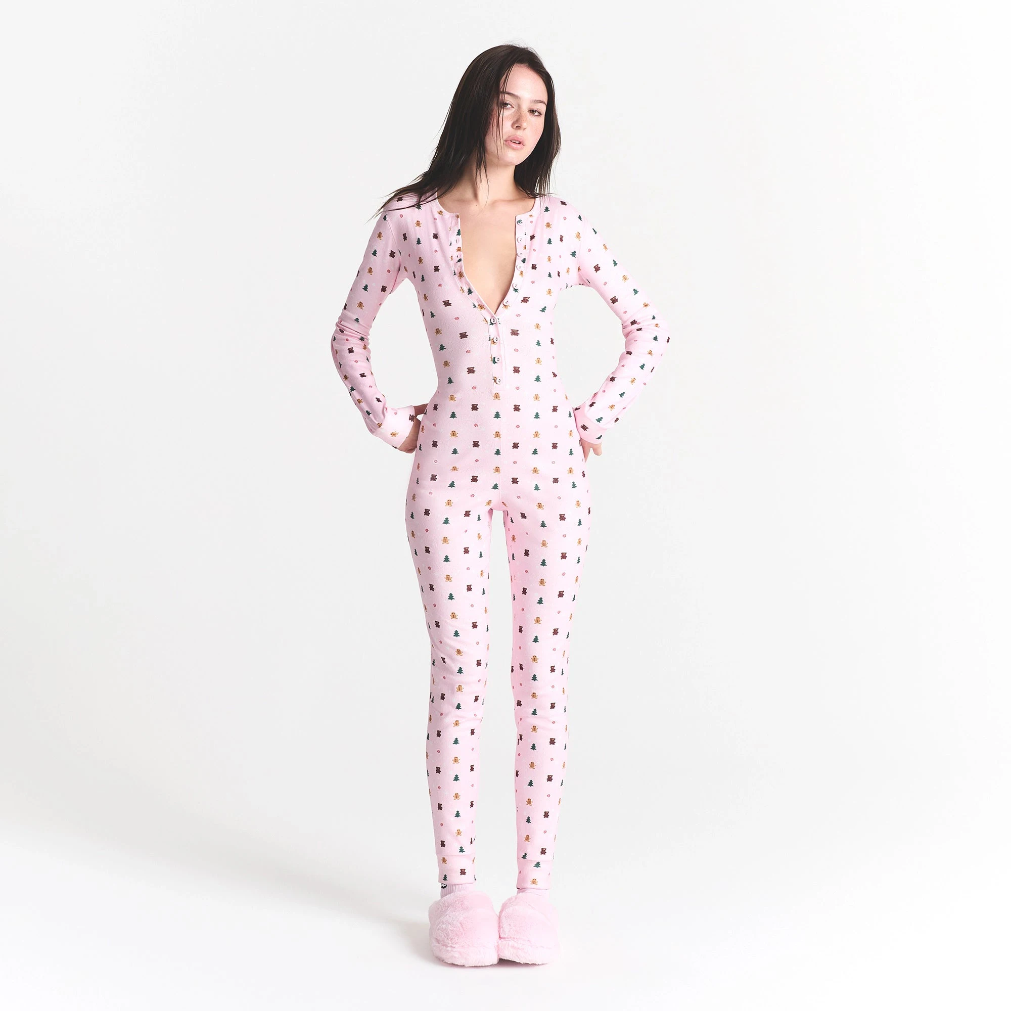 CACTUS PLANT FLEA MARKET X SKIMS PLUSH POINTELLE ONESIE | CHERRY BLOSSOM SNOW PRINT ON A MODEL FRONT VIEW @ | FOCUS: 0.0, 1.0, 0.9