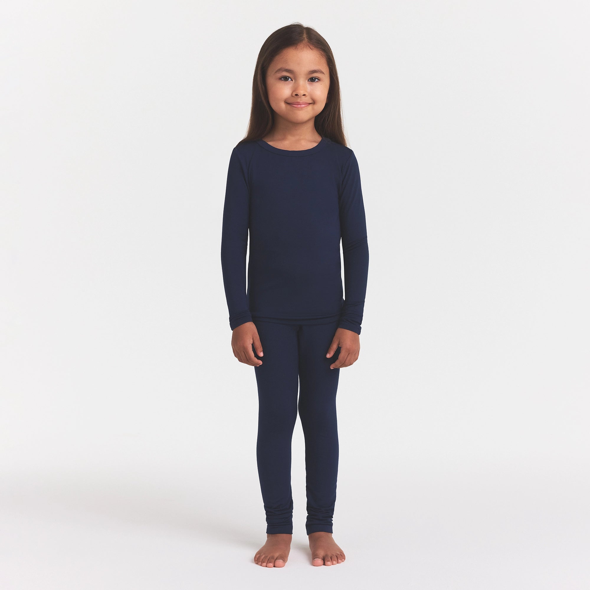 SKIMS SLEEP KIDS SLEEP SET | NAVY ON A MODEL FRONT VIEW
