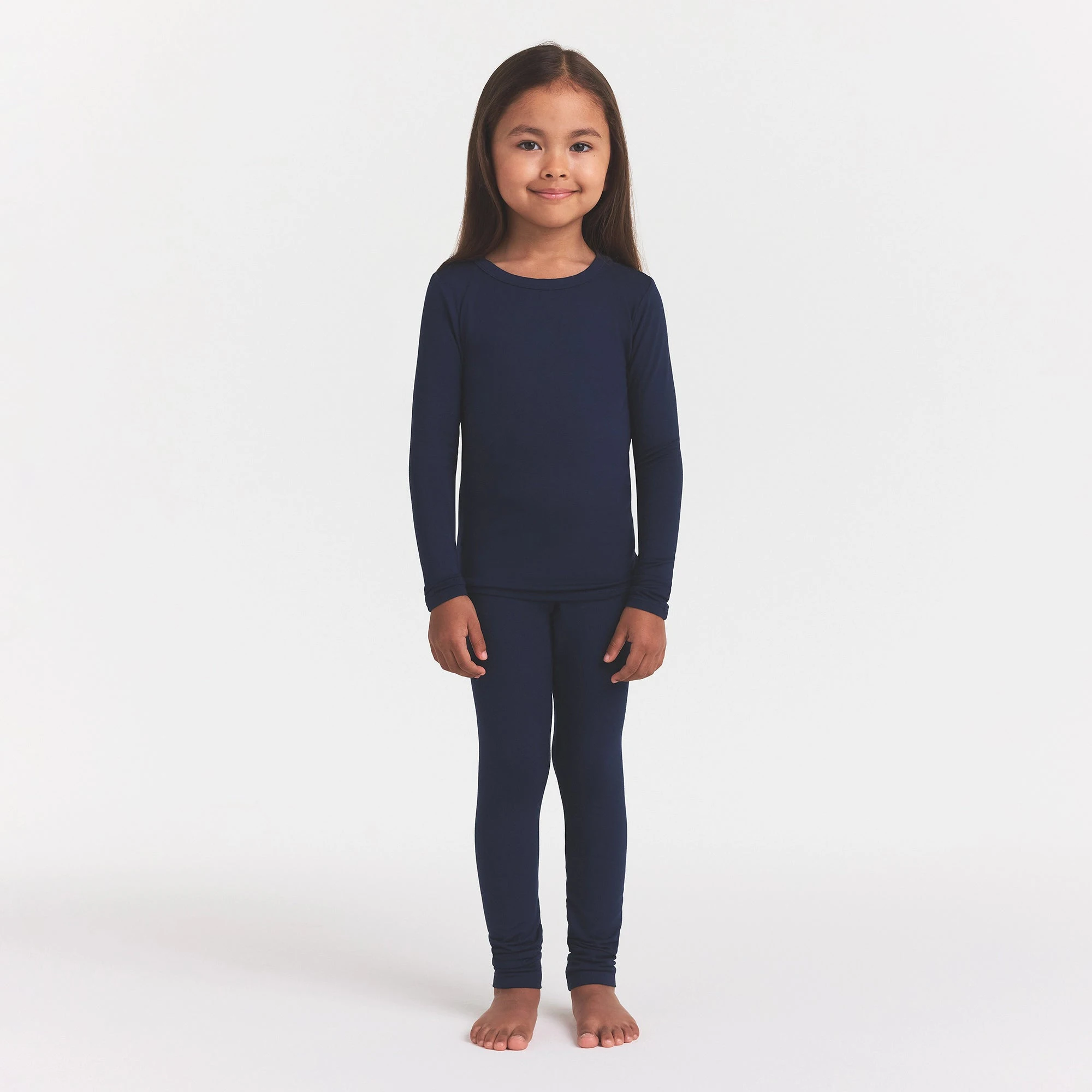 SKIMS SLEEP KIDS SLEEP SET | NAVY ON A MODEL FRONT VIEW