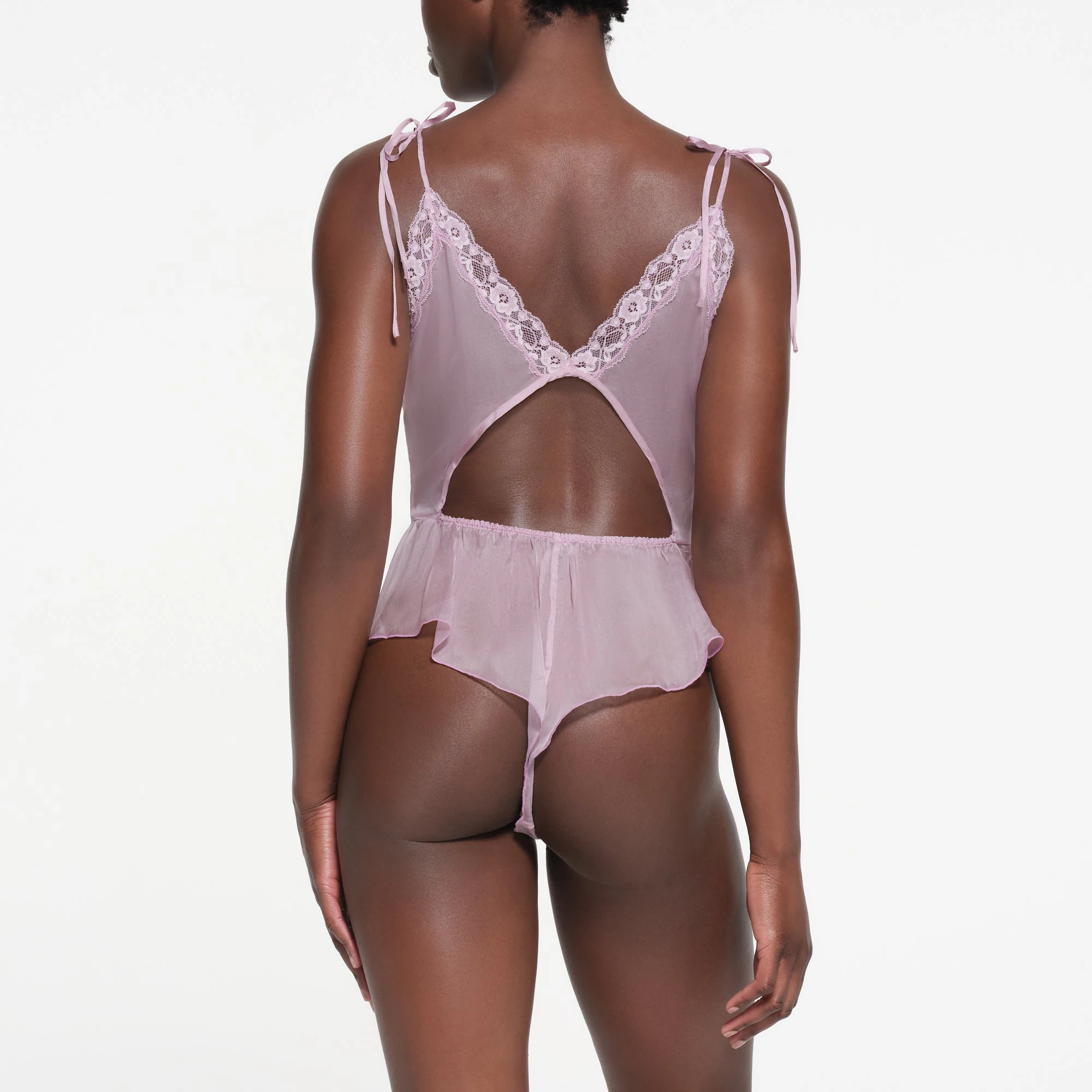 SKIMS ROMANCE TEDDY | IRIS MICA ON A MODEL BACK VIEW