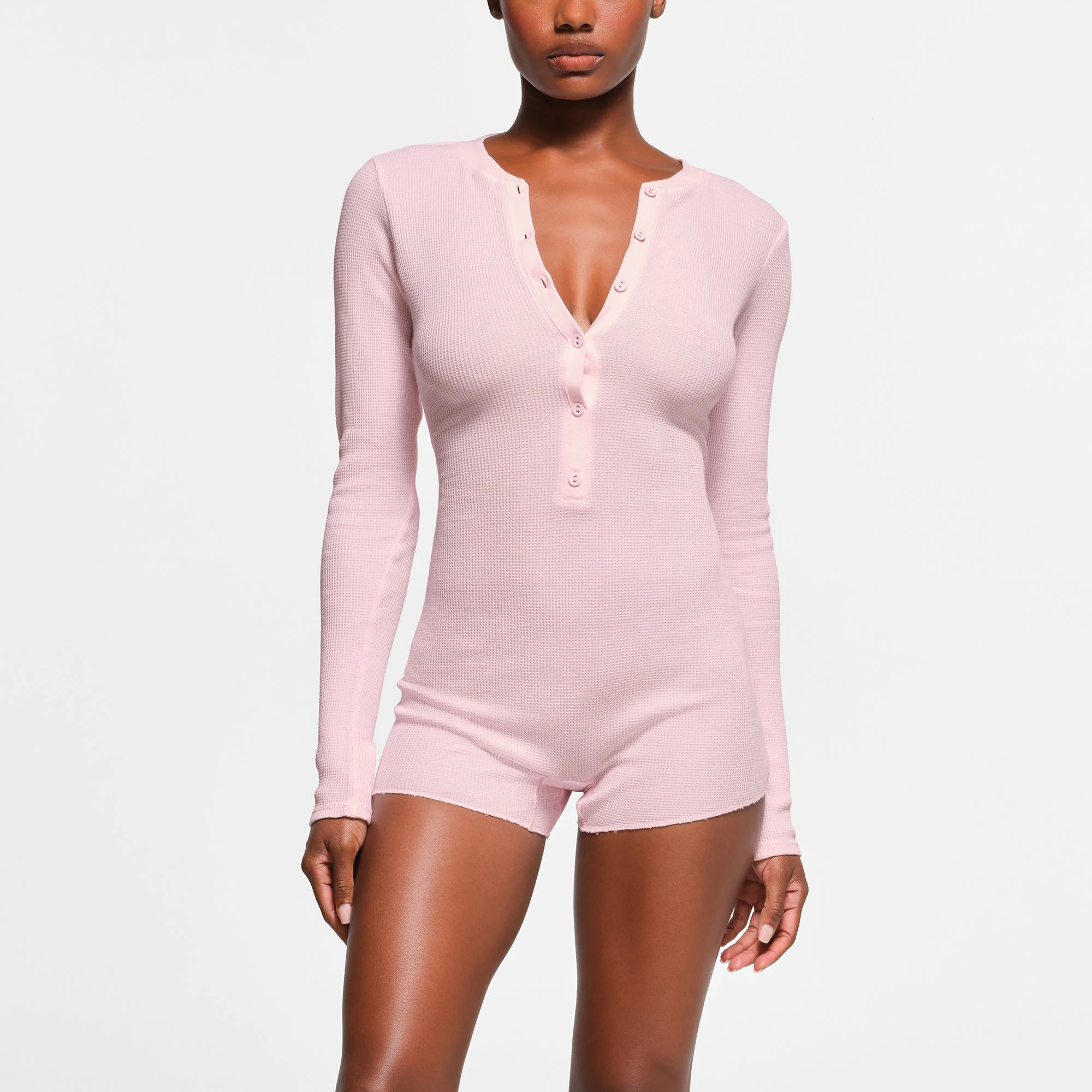 WAFFLE BUTTON UP HENLEY ONESIE | CHERRY BLOSSOM ON A MODEL FRONT VIEW