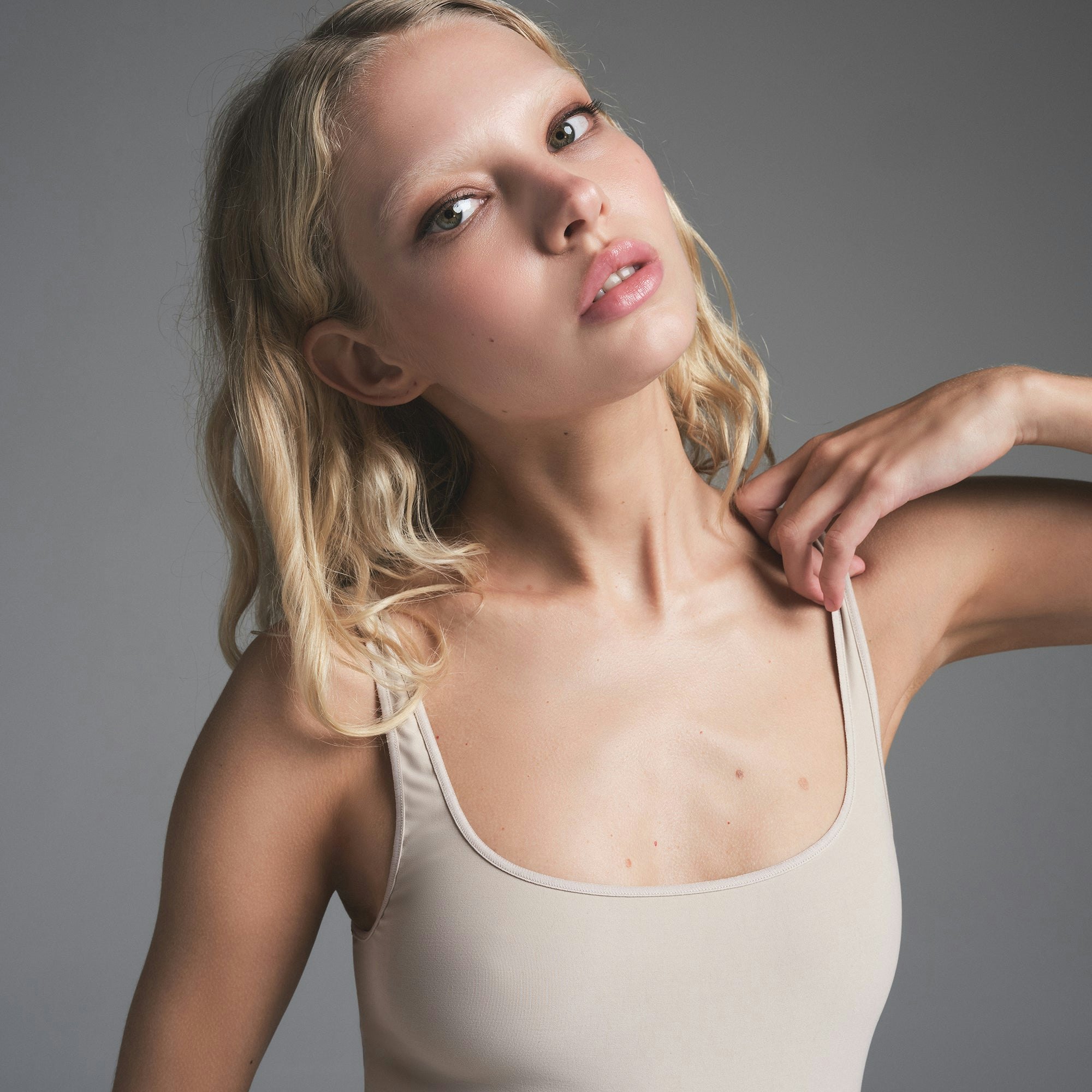 SOFT SMOOTHING SEAMLESS CATSUIT | STONE ON A MODEL FRONT VIEW