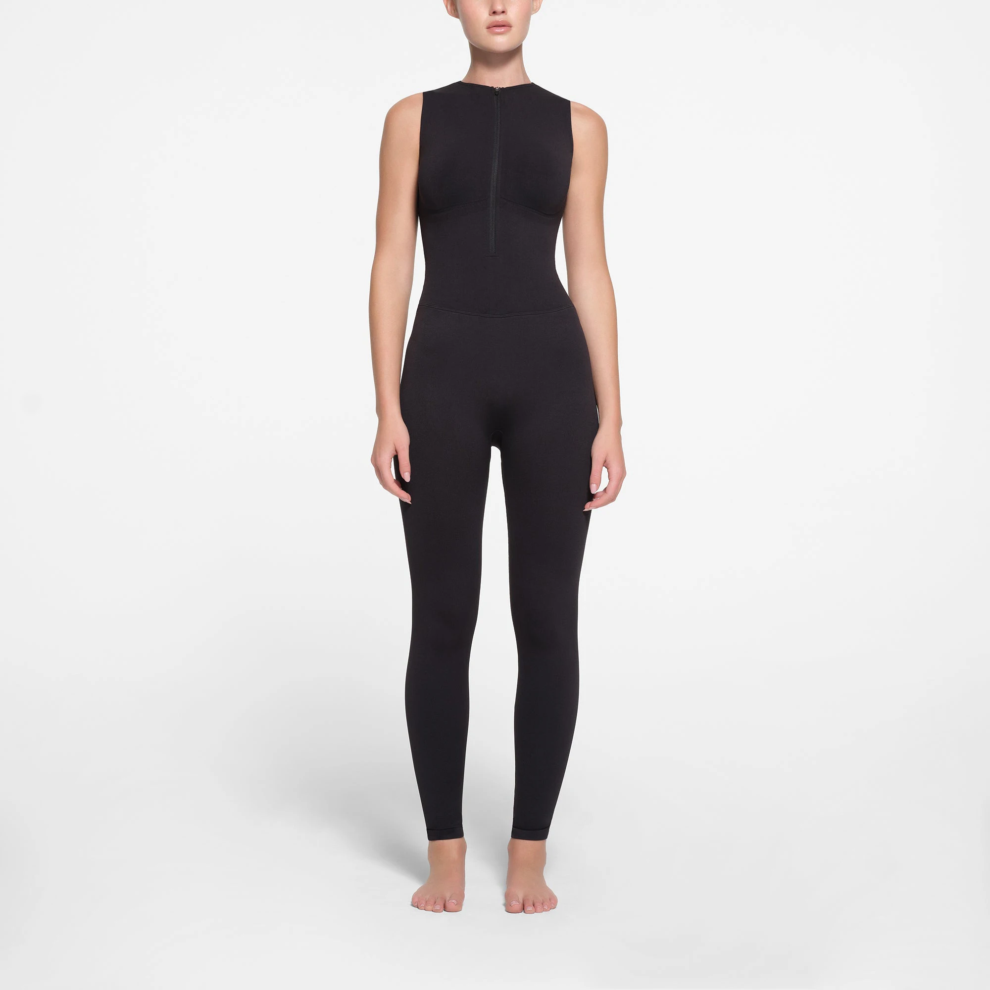 CONTOUR NYLON ZIP FRONT CATSUIT | ONYX ON A MODEL FRONT VIEW