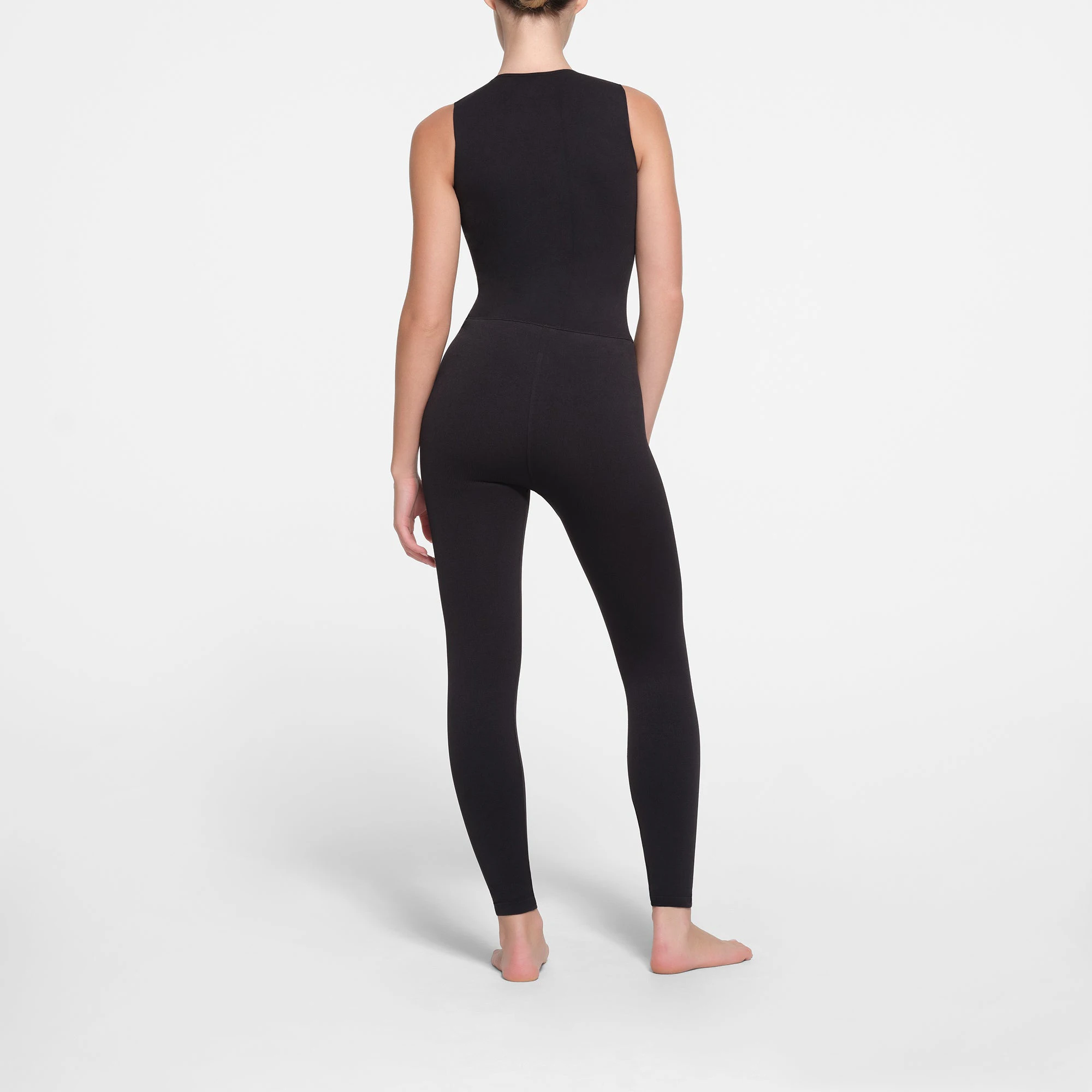 CONTOUR NYLON ZIP FRONT CATSUIT | ONYX ON A MODEL BACK VIEW