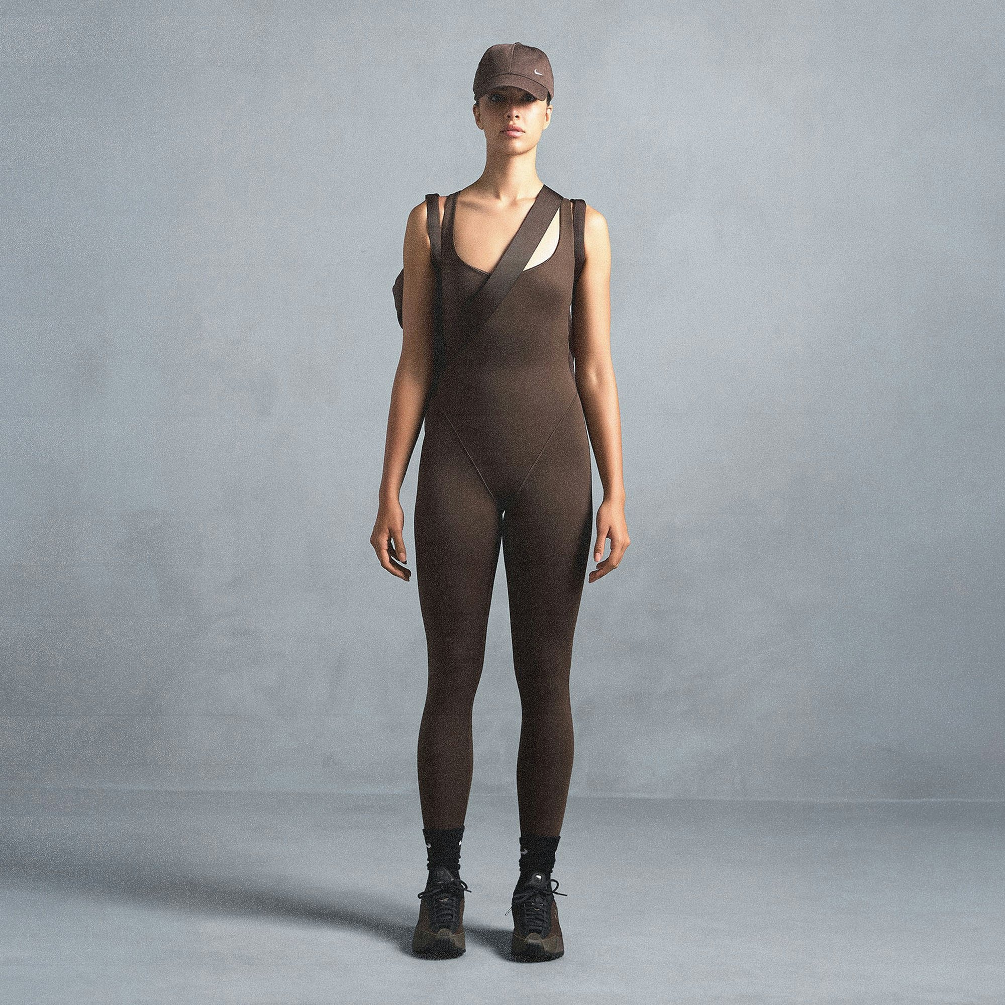NikeSKIMS MATTE RACER LONG ONESIE | DARK SEPIA ON A MODEL SIDE VIEW @ | FOCUS: 0.0, 1.0, 0.9