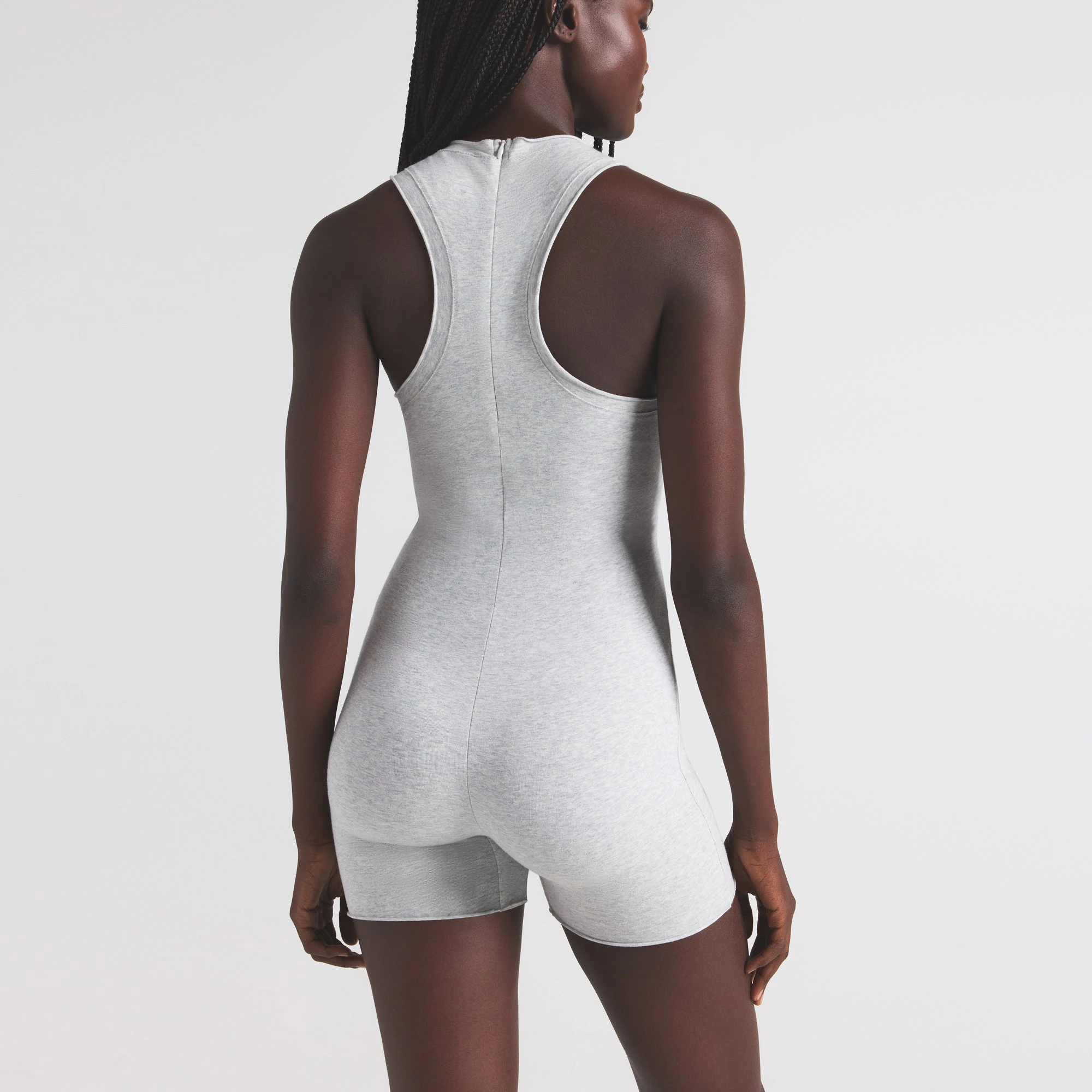 COTTON JERSEY TANK ONESIE | LIGHT HEATHER GREY ON A MODEL SIDE VIEW | FOCUS: 0.0, 1.0, 0.9