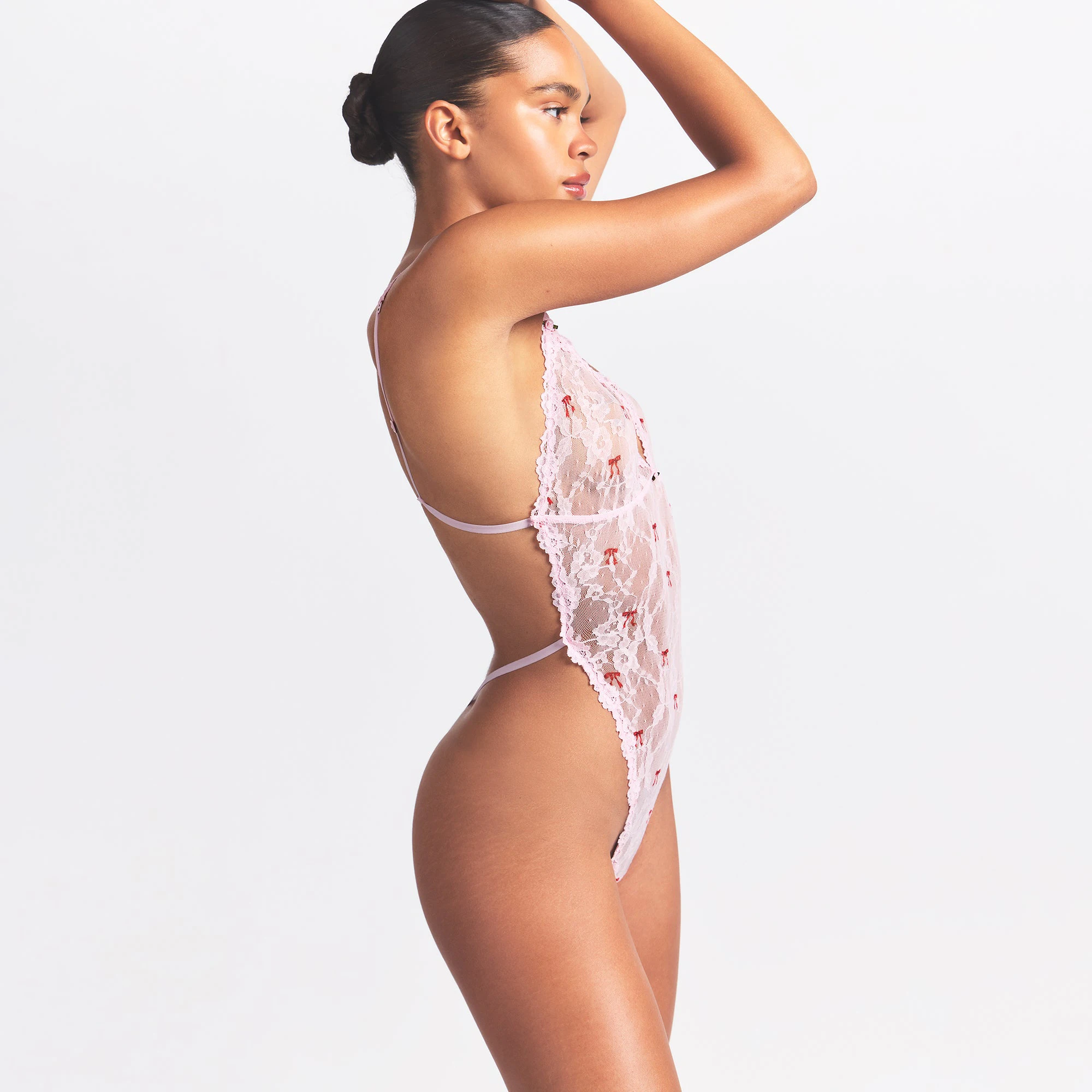 STRETCH LACE TEDDY | CHERRY BLOSSOM BOW PRINT ON A MODEL SIDE VIEW @ | FOCUS: 0.0, 1.0, 0.9