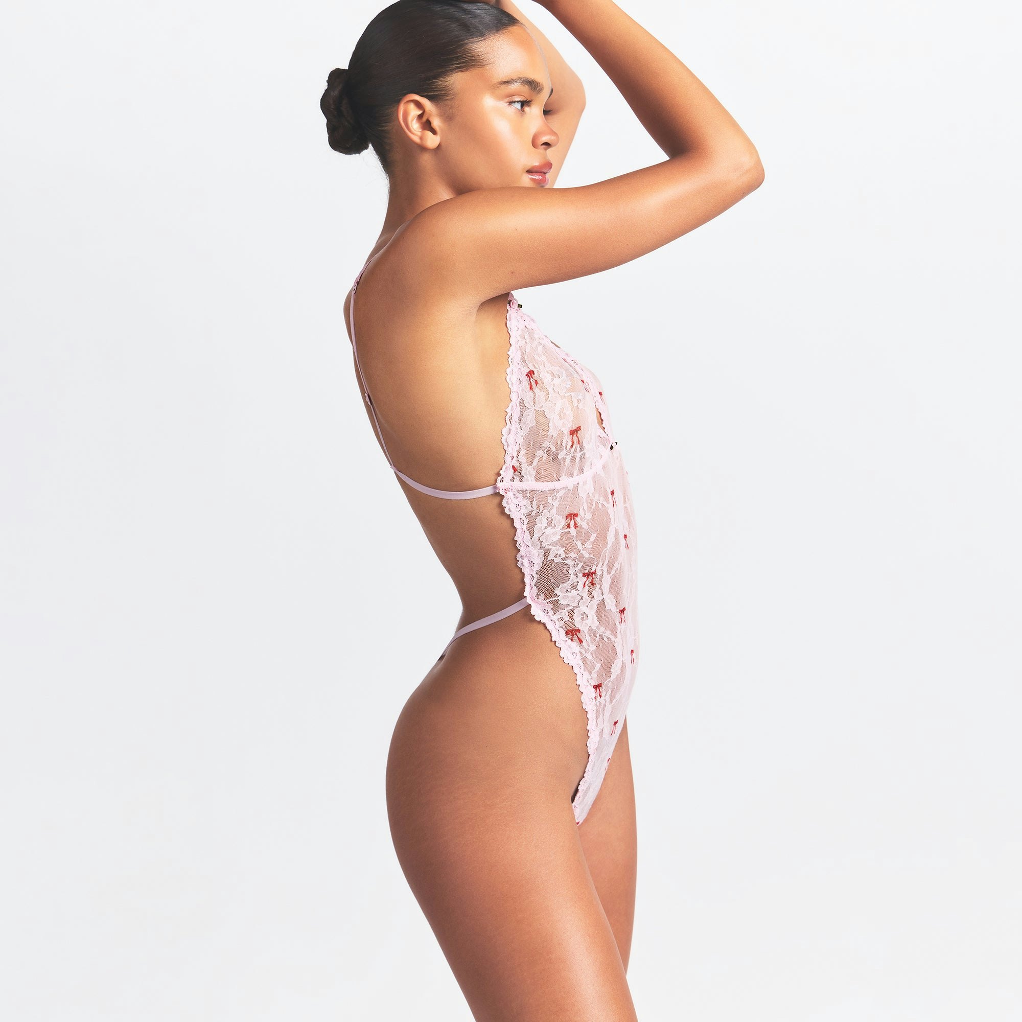 STRETCH LACE TEDDY | CHERRY BLOSSOM BOW PRINT ON A MODEL SIDE VIEW @ | FOCUS: 0.0, 1.0, 0.9