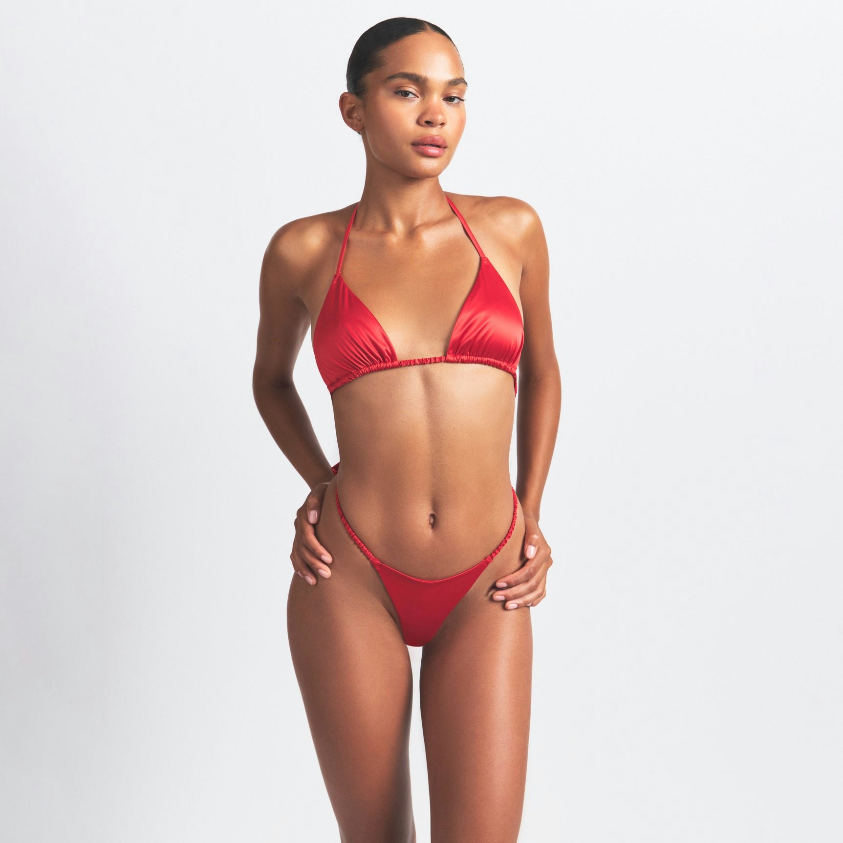 WOVEN SHINE SKIMPY BOW TEDDY | RED ON A MODEL SIDE VIEW @ | FOCUS: 0.0, 1.0, 0.9