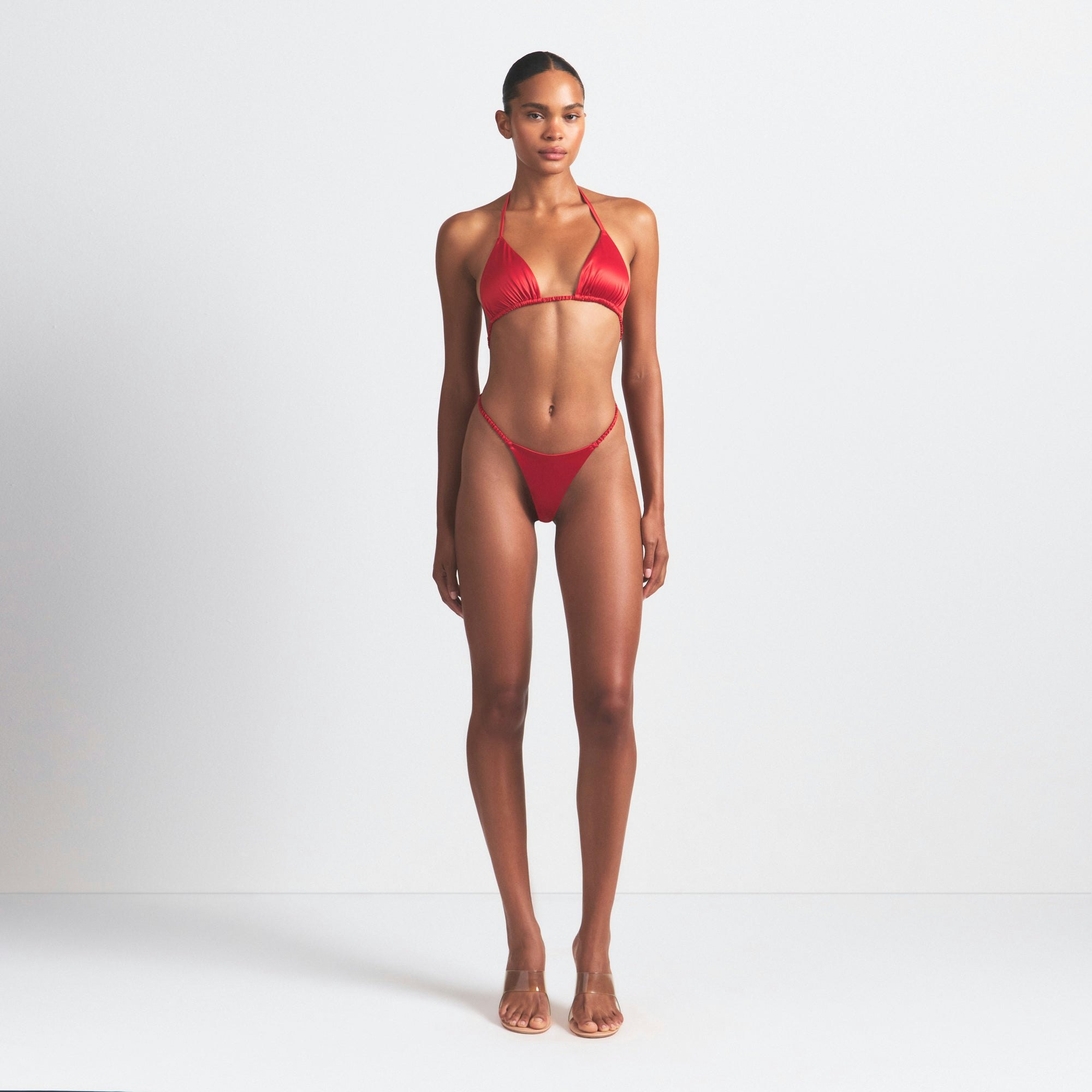 WOVEN SHINE SKIMPY BOW TEDDY | RED ON A MODEL FRONT VIEW @ | FOCUS: 0.0, 1.0, 0.9