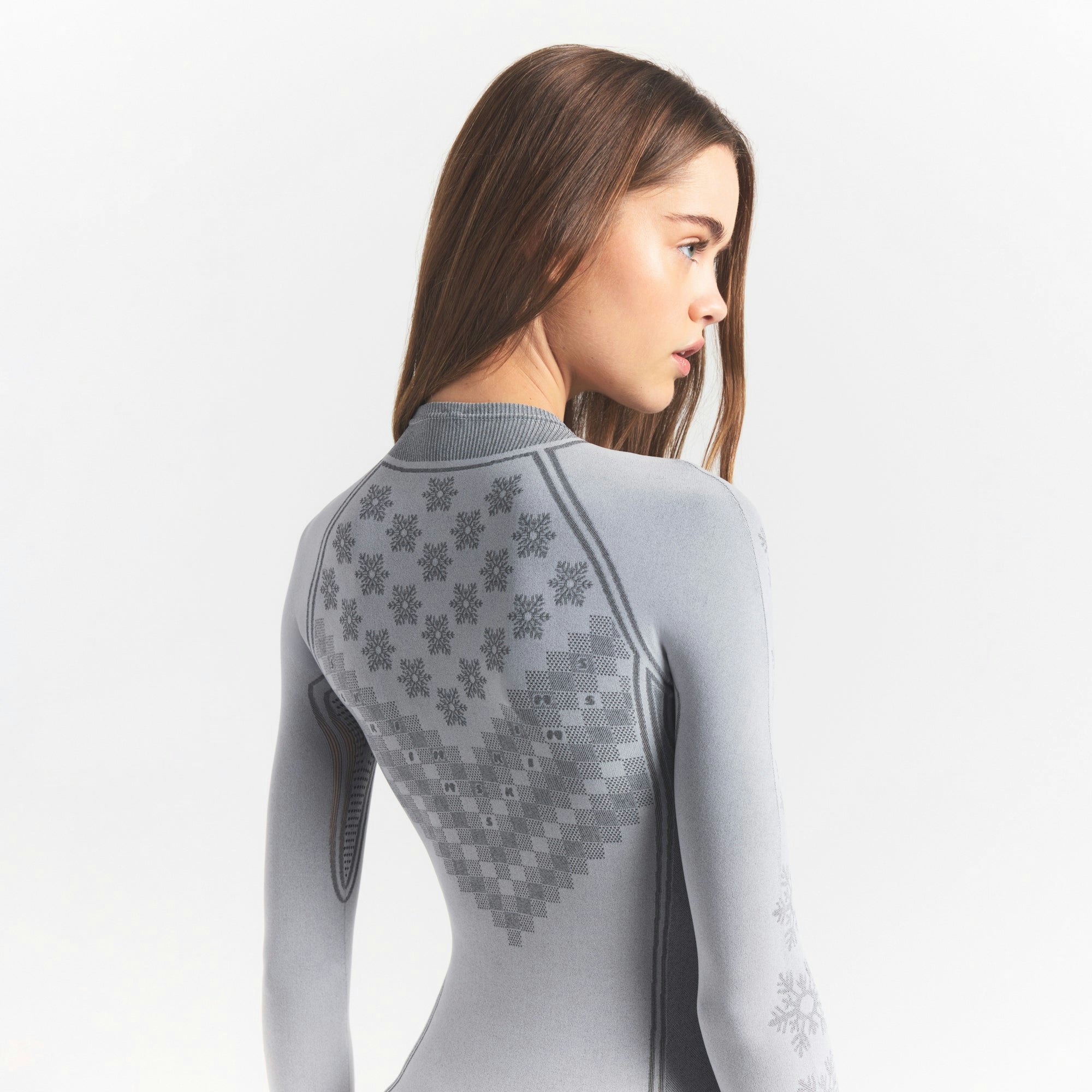 SKIMS FIRST LAYERS HALF ZIP ONESIE | MIRROR WINTER FAIR ISLE ON A MODEL SIDE VIEW @ | FOCUS: 0.0, 1.0, 0.9