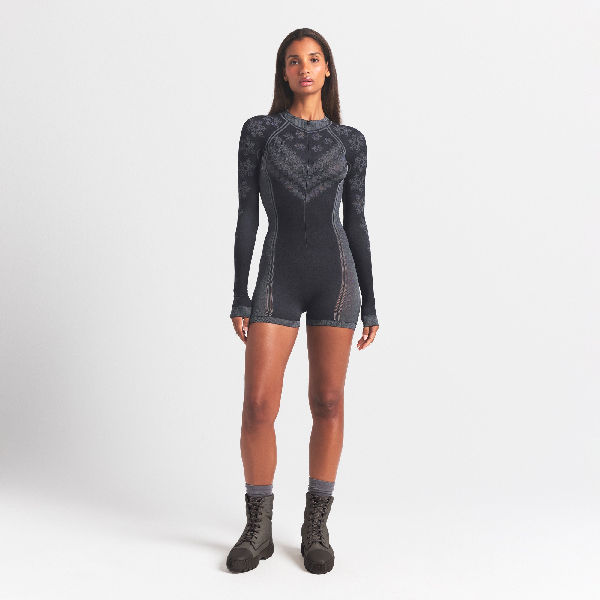 SKIMS FIRST LAYERS HALF ZIP ONESIE | OBSIDIAN WINTER FAIR ISLE ON A MODEL FRONT VIEW @ | FOCUS: 0.0, 1.0, 0.9