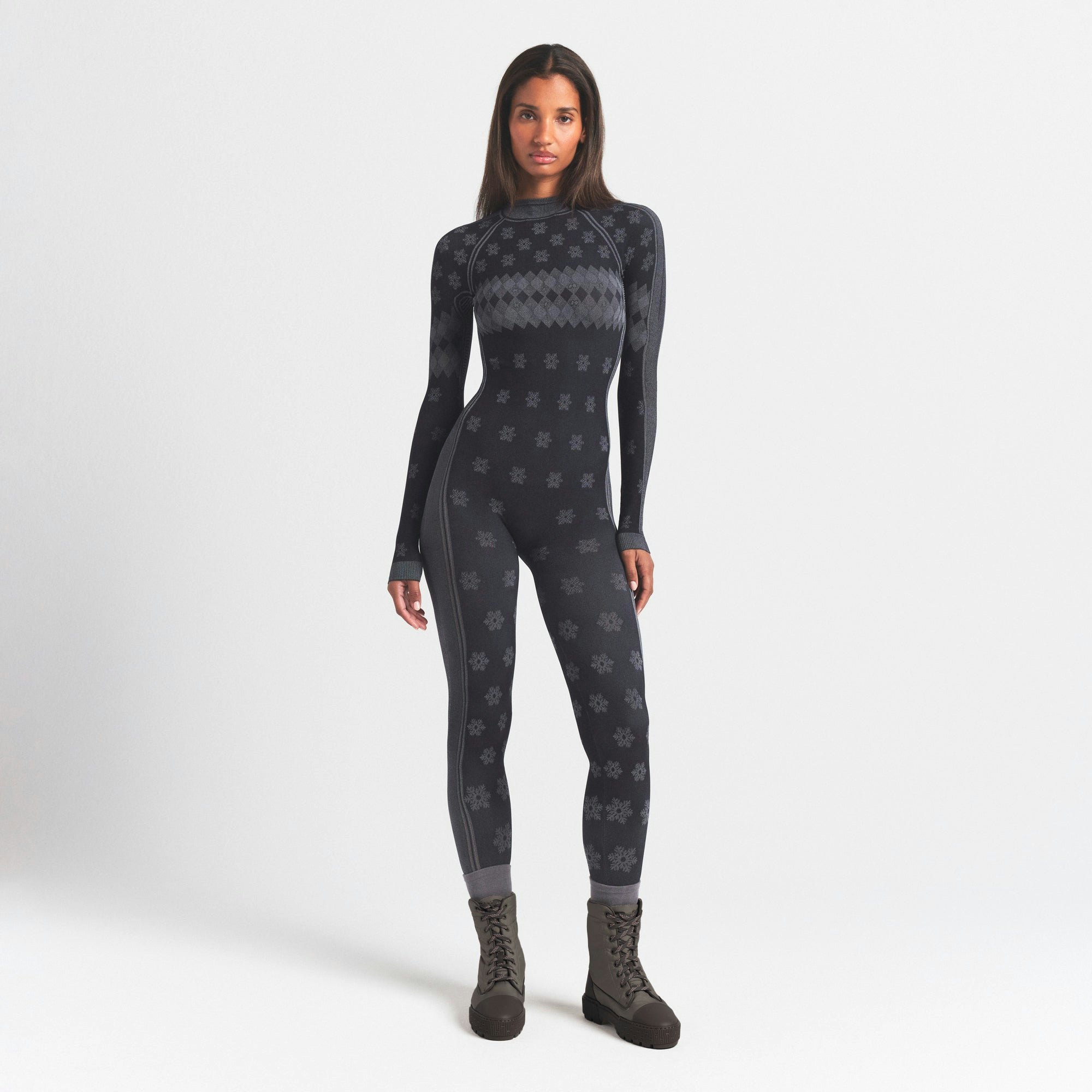 SKIMS FIRST LAYERS TURTLENECK CATSUIT | OBSIDIAN WINTER FAIR ISLE ON A MODEL FRONT VIEW @ | FOCUS: 0.0, 1.0, 0.9