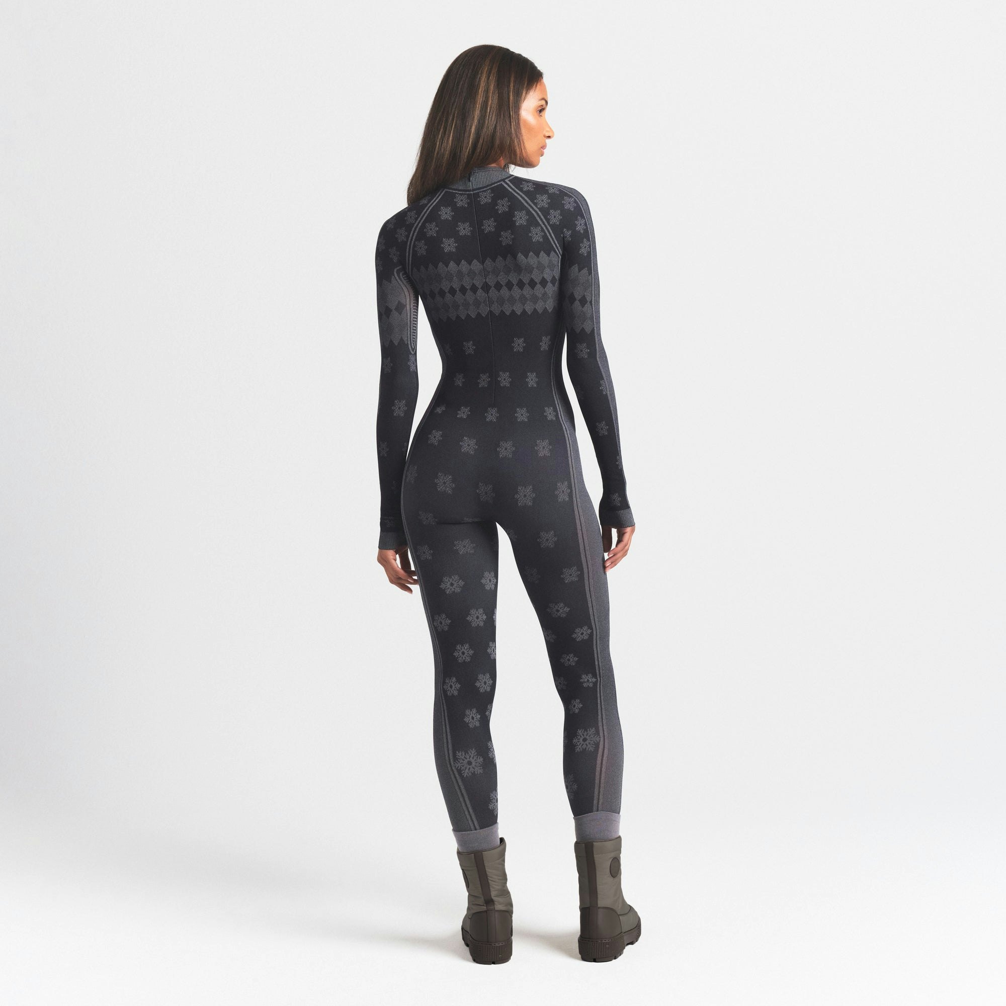 SKIMS FIRST LAYERS TURTLENECK CATSUIT | OBSIDIAN WINTER FAIR ISLE ON A MODEL SIDE VIEW @ | FOCUS: 0.0, 1.0, 0.9