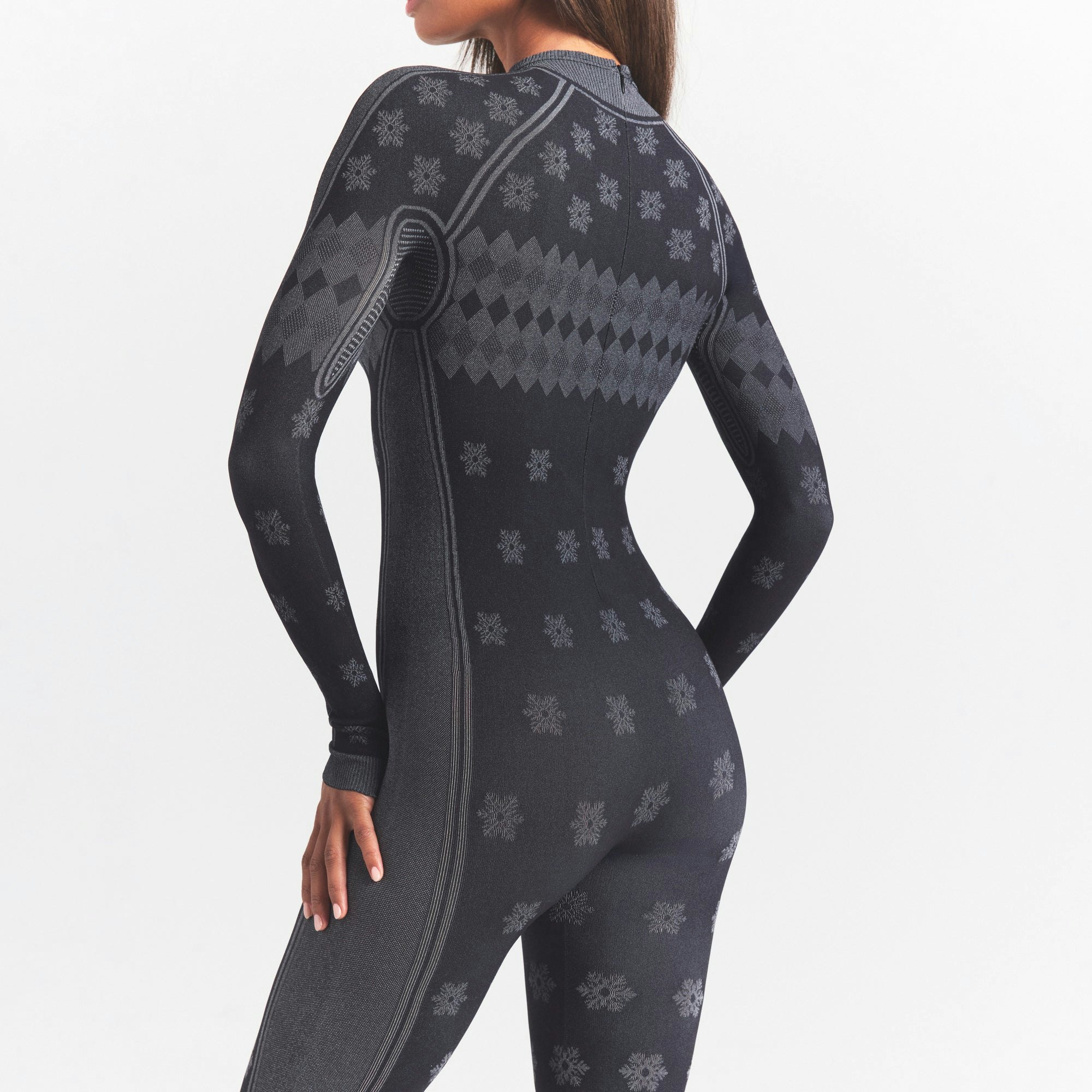 SKIMS FIRST LAYERS TURTLENECK CATSUIT | OBSIDIAN WINTER FAIR ISLE ON A MODEL SIDE VIEW @ | FOCUS: 0.0, 1.0, 0.9