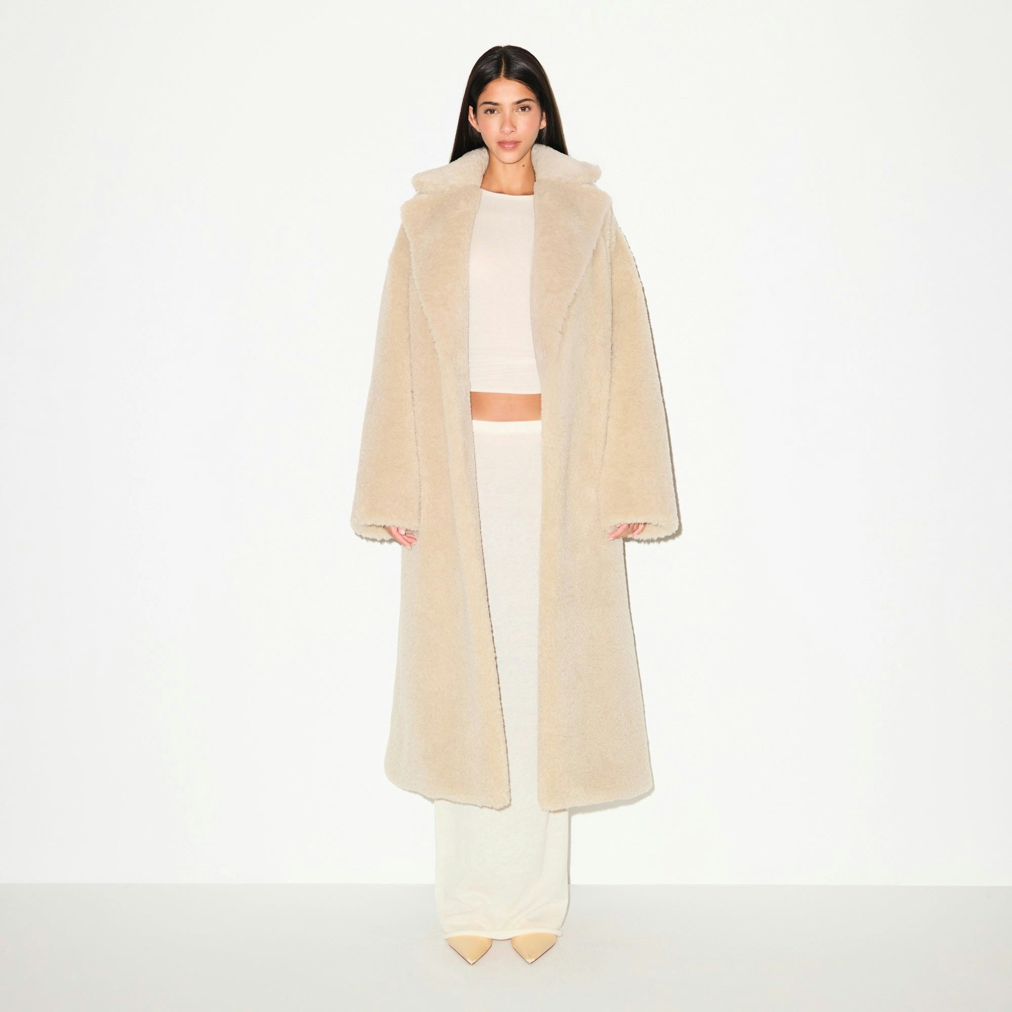 FAUX FUR OVERSIZED LONG COAT | CHAMPAGNE ON A MODEL FRONT VIEW @ | FOCUS: 0.9, 0.1, 0.7