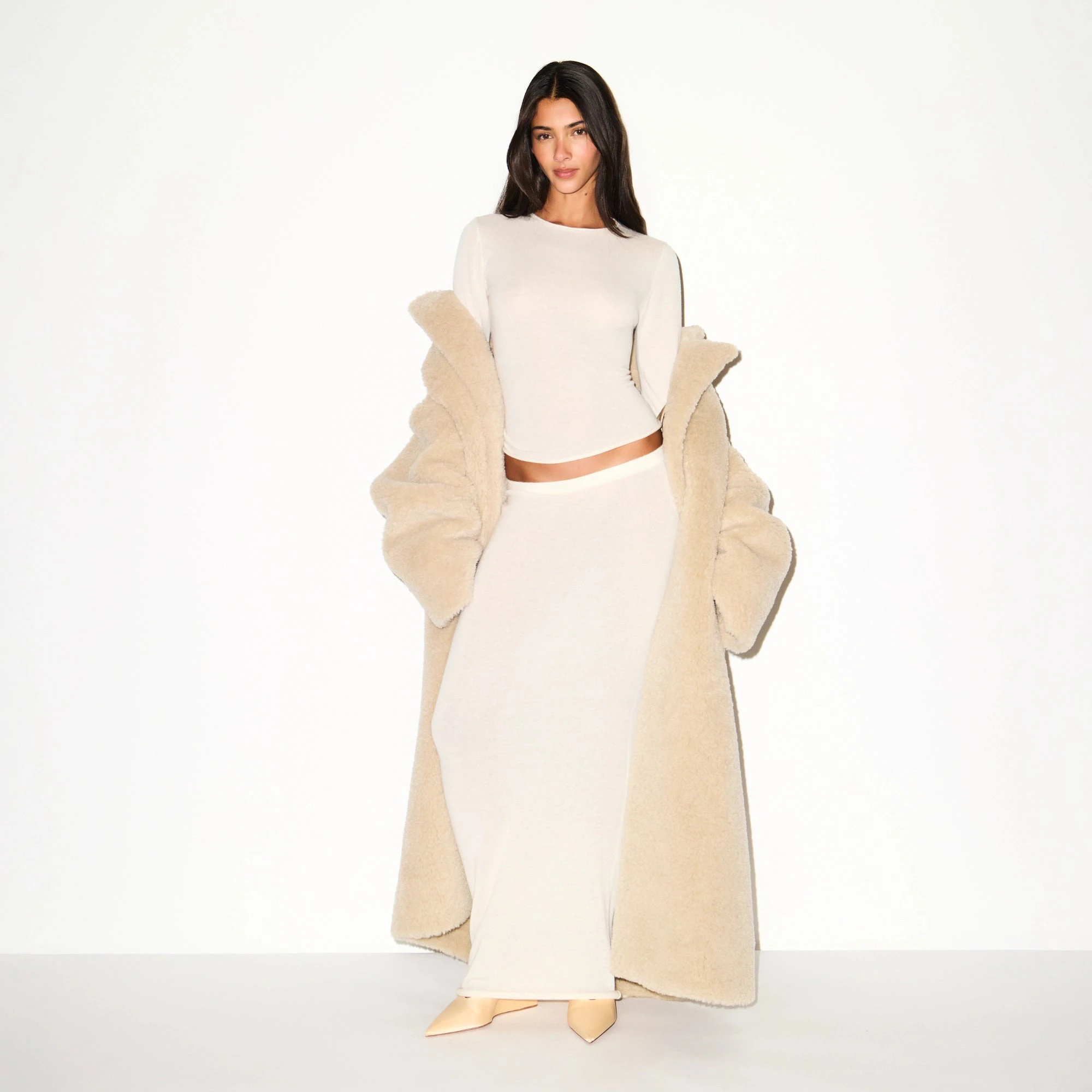 FAUX FUR OVERSIZED LONG COAT | CHAMPAGNE ON A MODEL FRONT VIEW @ | FOCUS: 0.9, 0.1, 0.7