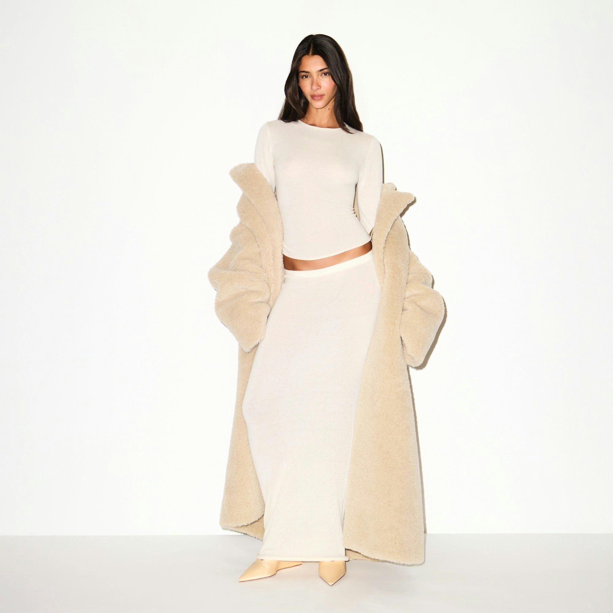 FAUX FUR OVERSIZED LONG COAT | CHAMPAGNE ON A MODEL FRONT VIEW @ | FOCUS: 0.9, 0.1, 0.7