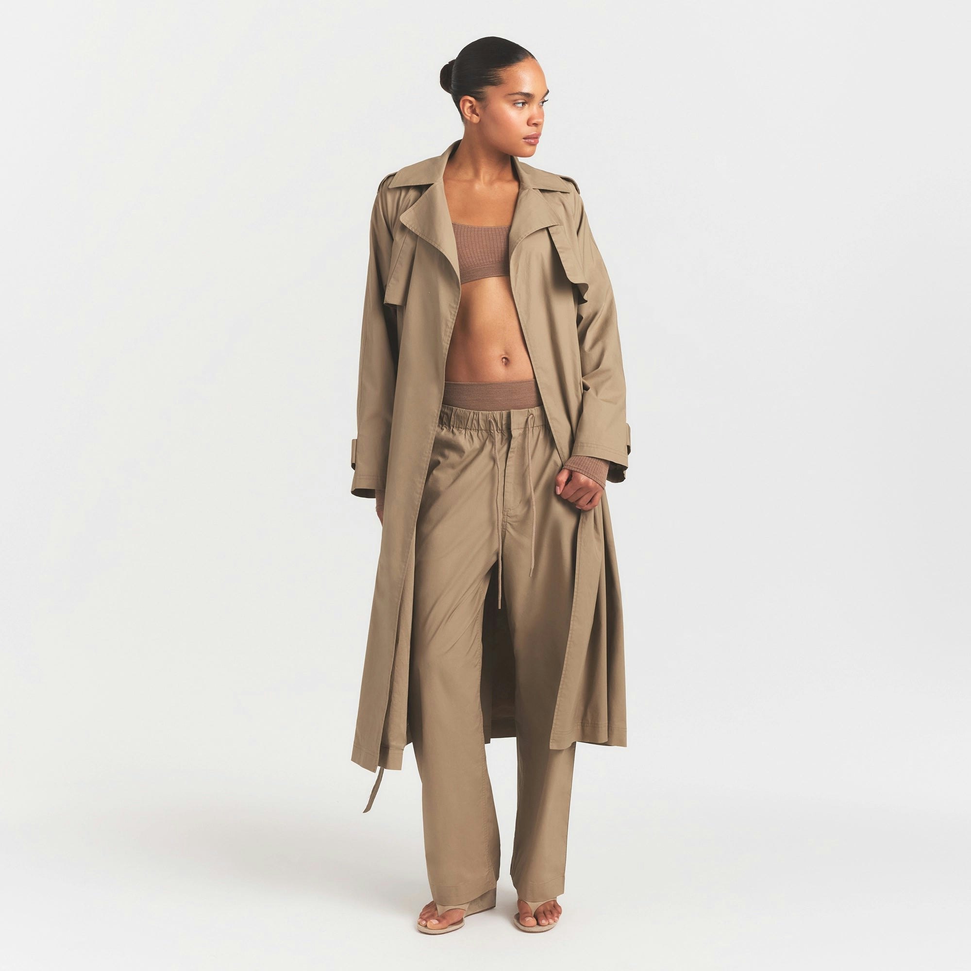 WOVEN COTTON OVERSIZED TRENCH COAT | DESERT ON A MODEL FRONT VIEW @ | FOCUS: 0.0, 1.0, 0.9