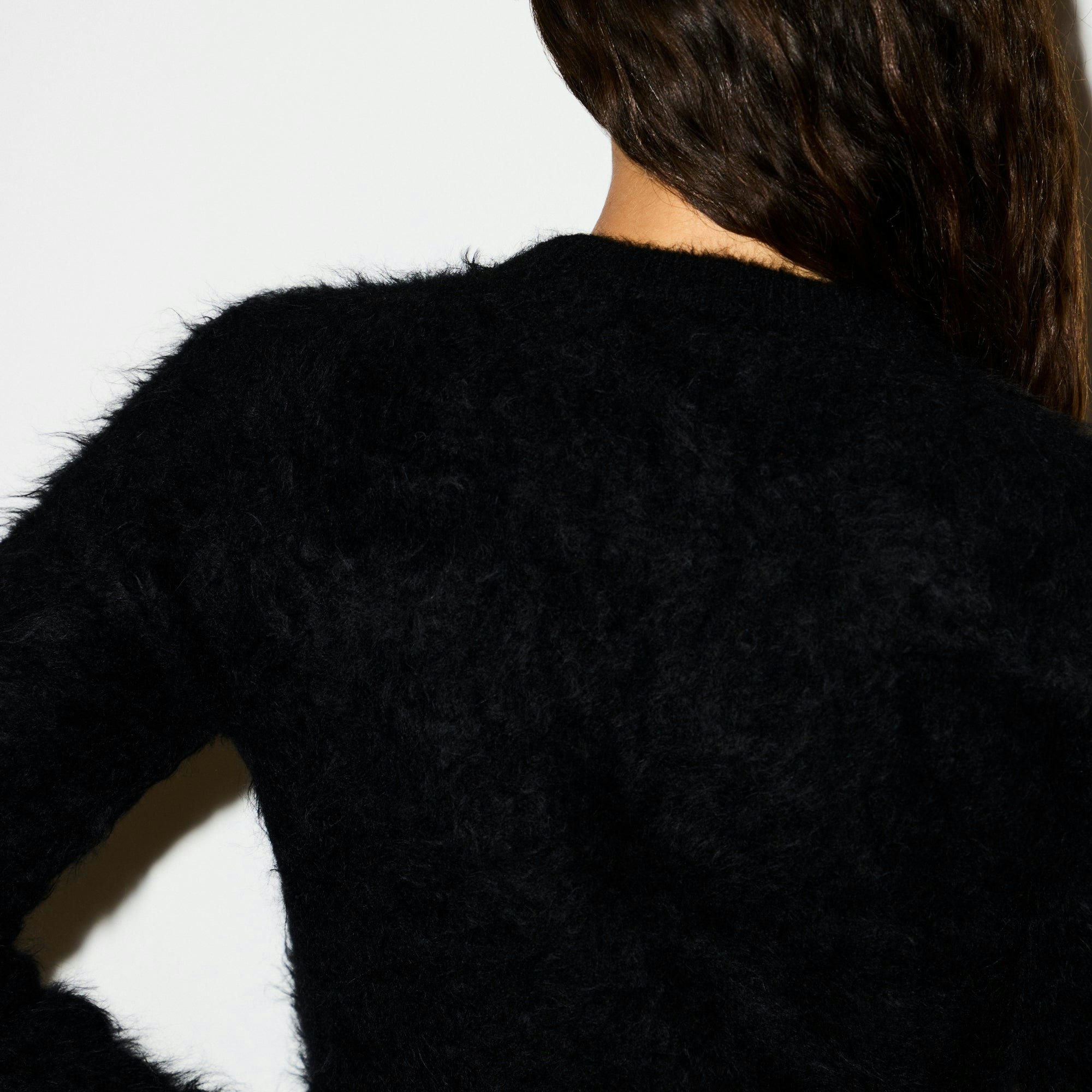 BRUSHED ALPACA CREWNECK SWEATER | ONYX ON A MODEL SIDE VIEW @ | FOCUS: 0.0, 1.0, 0.9