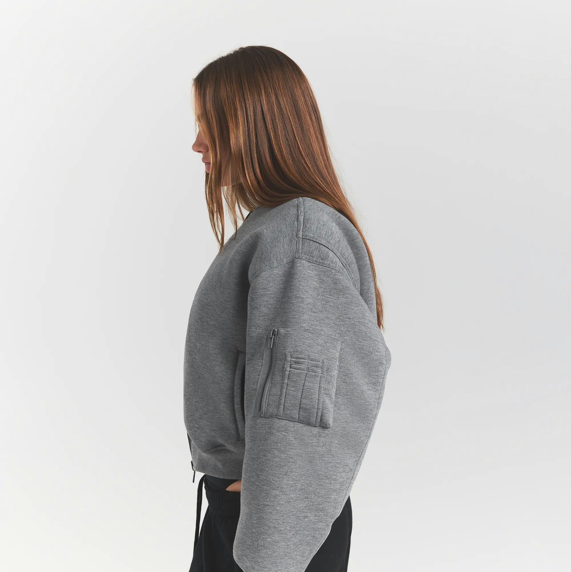 NEOPRENE OUTERWEAR REVERSIBLE BOMBER JACKET | DARK HEATHER GREY ON A MODEL SIDEVIEW @ | FOCUS: 0.0, 1.0, 0.9 