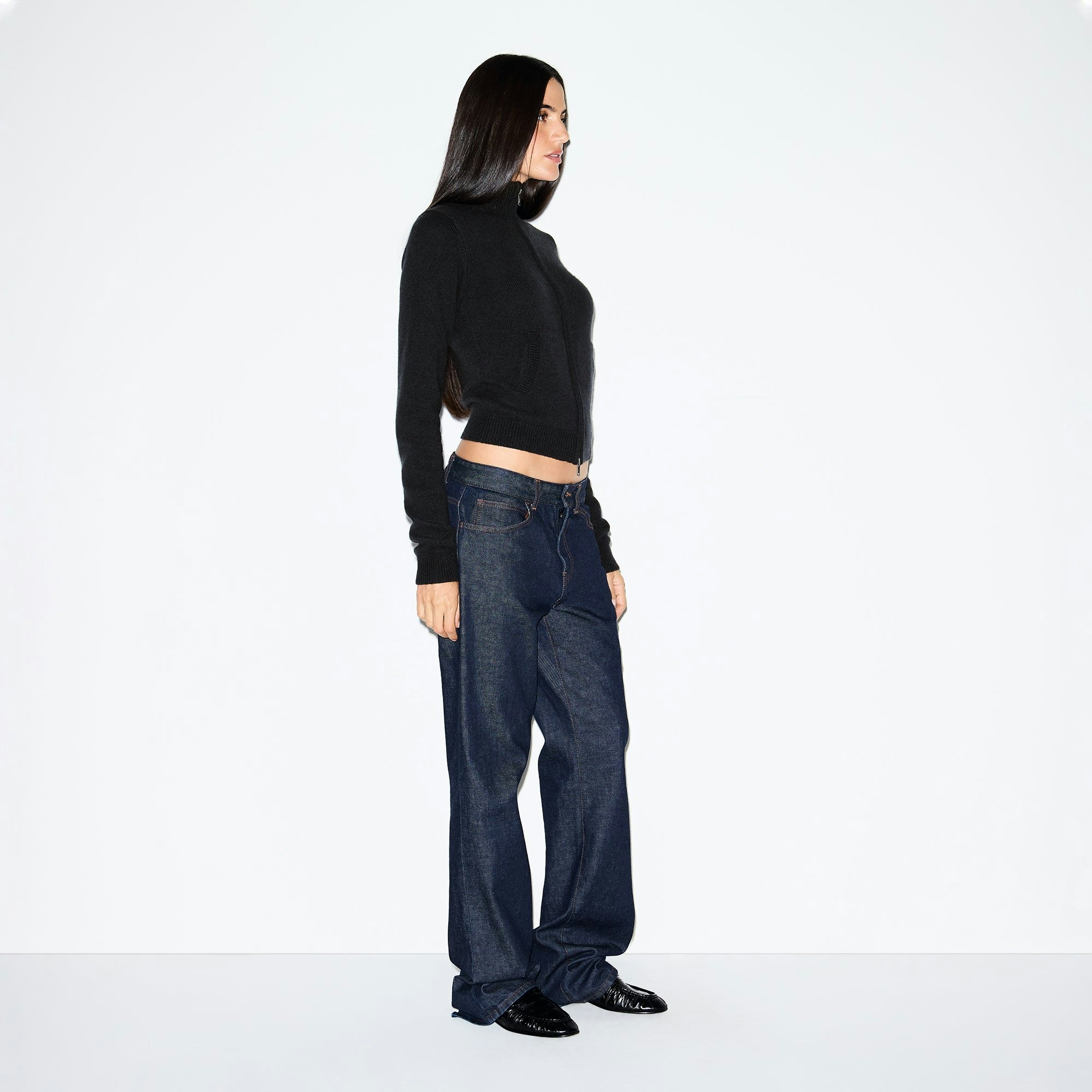 WOOL CASHMERE ZIP UP MOCK NECK SWEATER | ONYX ON A MODEL SIDE VIEW @ | FOCUS: 0.0, 1.0, 0.9