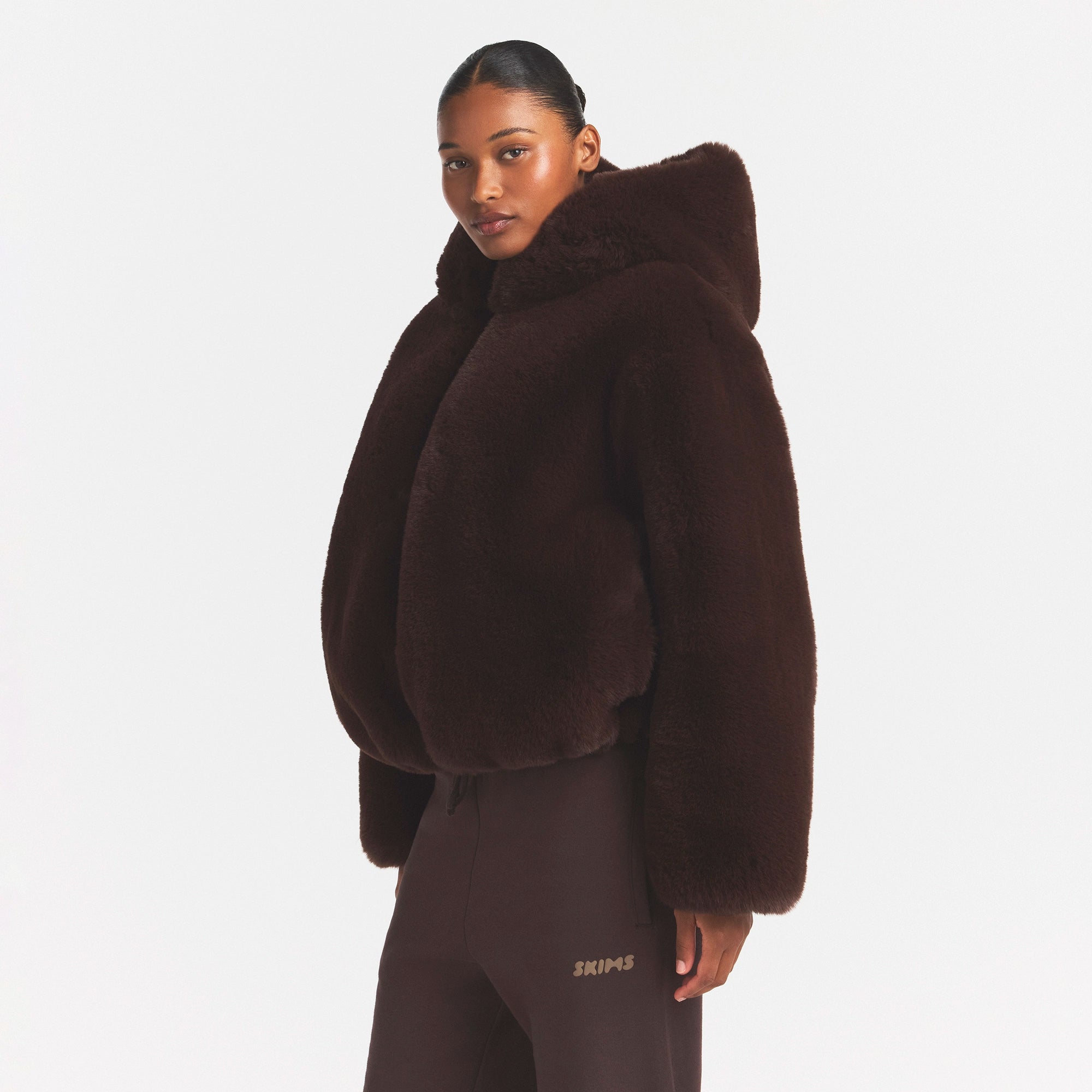 FAUX FUR HOODED JACKET | COCOA ON A MODEL FRONT VIEW @ | FOCUS: 0.0, 1.0, 0.9