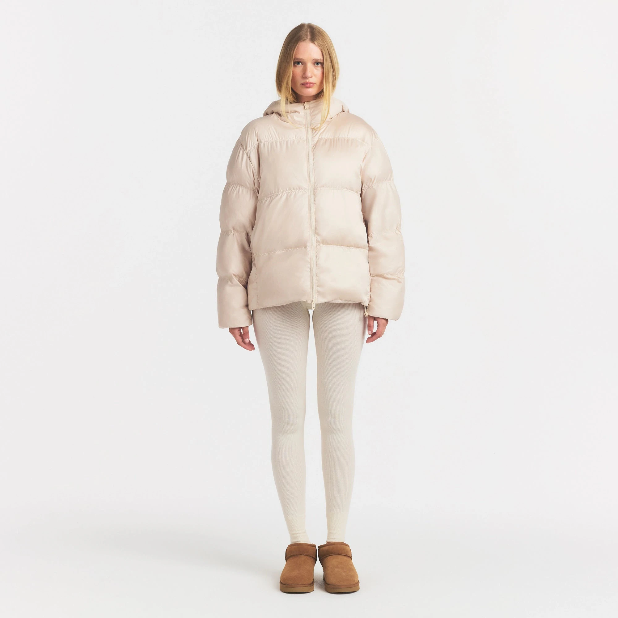 SKIMS PUFFER HOODED JACKET | CHAMPAGNE ON A MODEL FRONT VIEW @ | FOCUS: 0.0, 1.0, 0.9