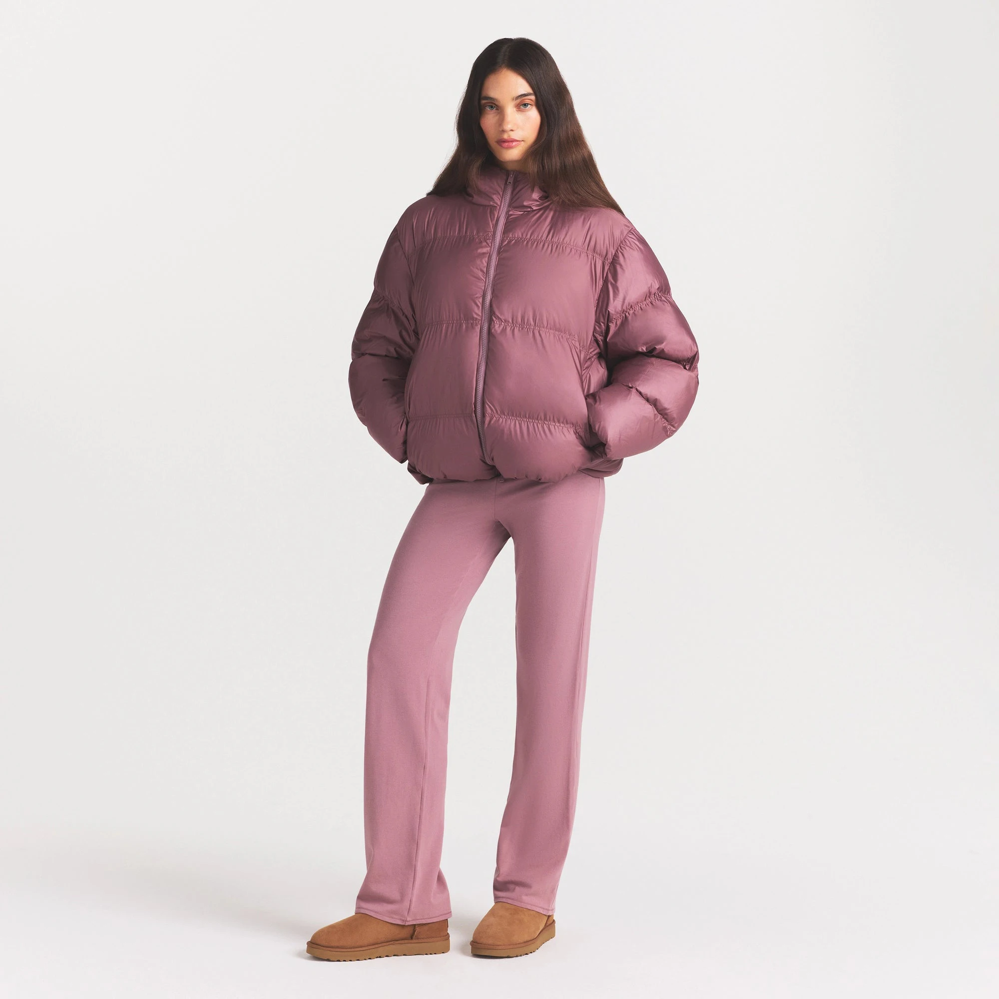 SKIMS PUFFER HOODED JACKET | MUTED MAUVE ON A MODEL FRONT VIEW @ | FOCUS: 0.0, 1.0, 0.9
