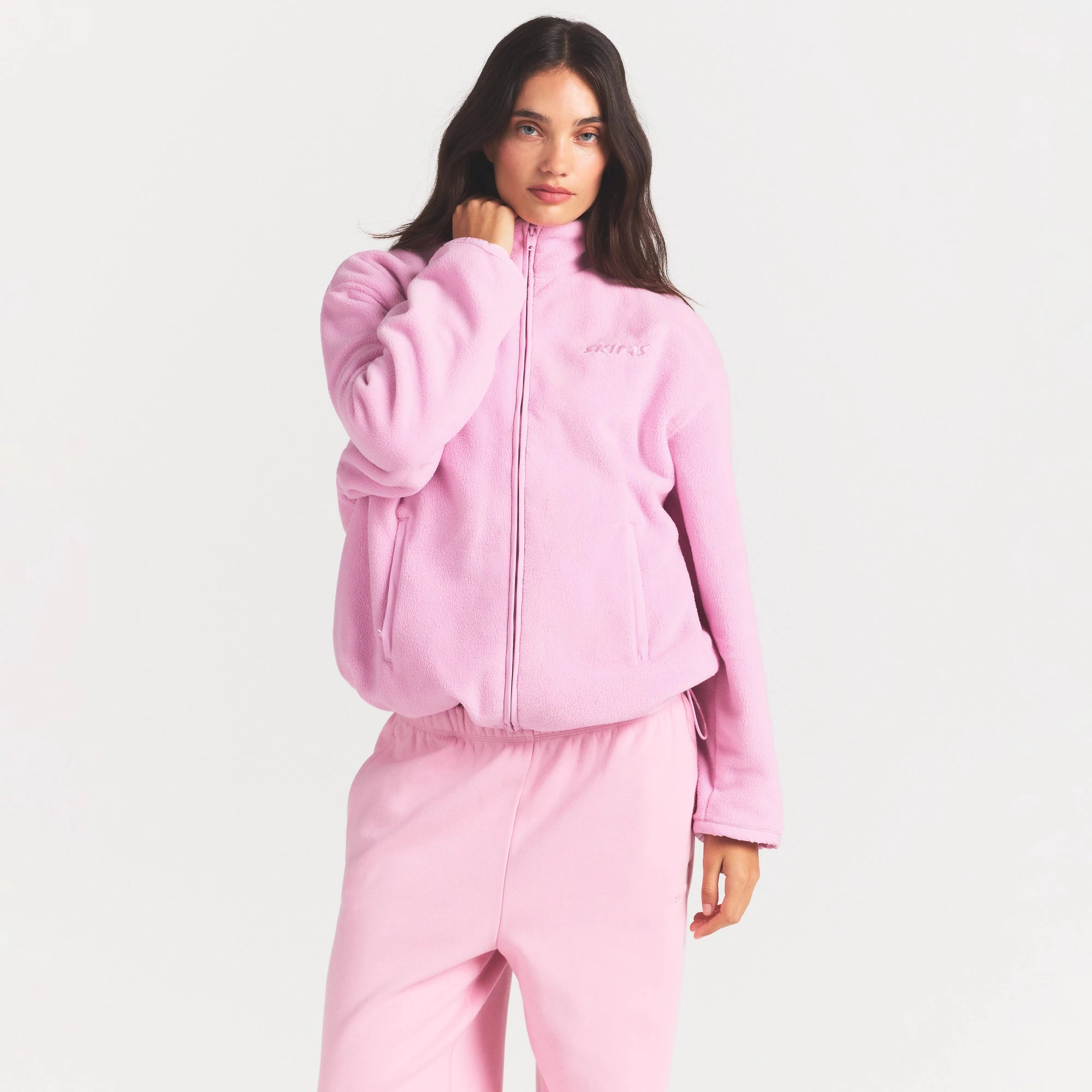 OUTDOOR FLEECE MOCK NECK ZIP UP | BUBBLEGUM ON A MODEL SIDE VIEW @ | FOCUS: 0.0, 1.0, 0.9