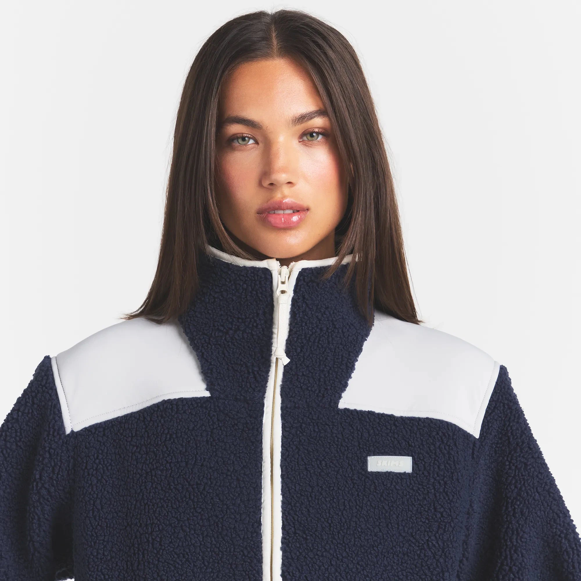 TEDDY BOXY ZIP UP JACKET | NAVY & LAYS FLAT ON A WHITE BACKGROUND | FLT
