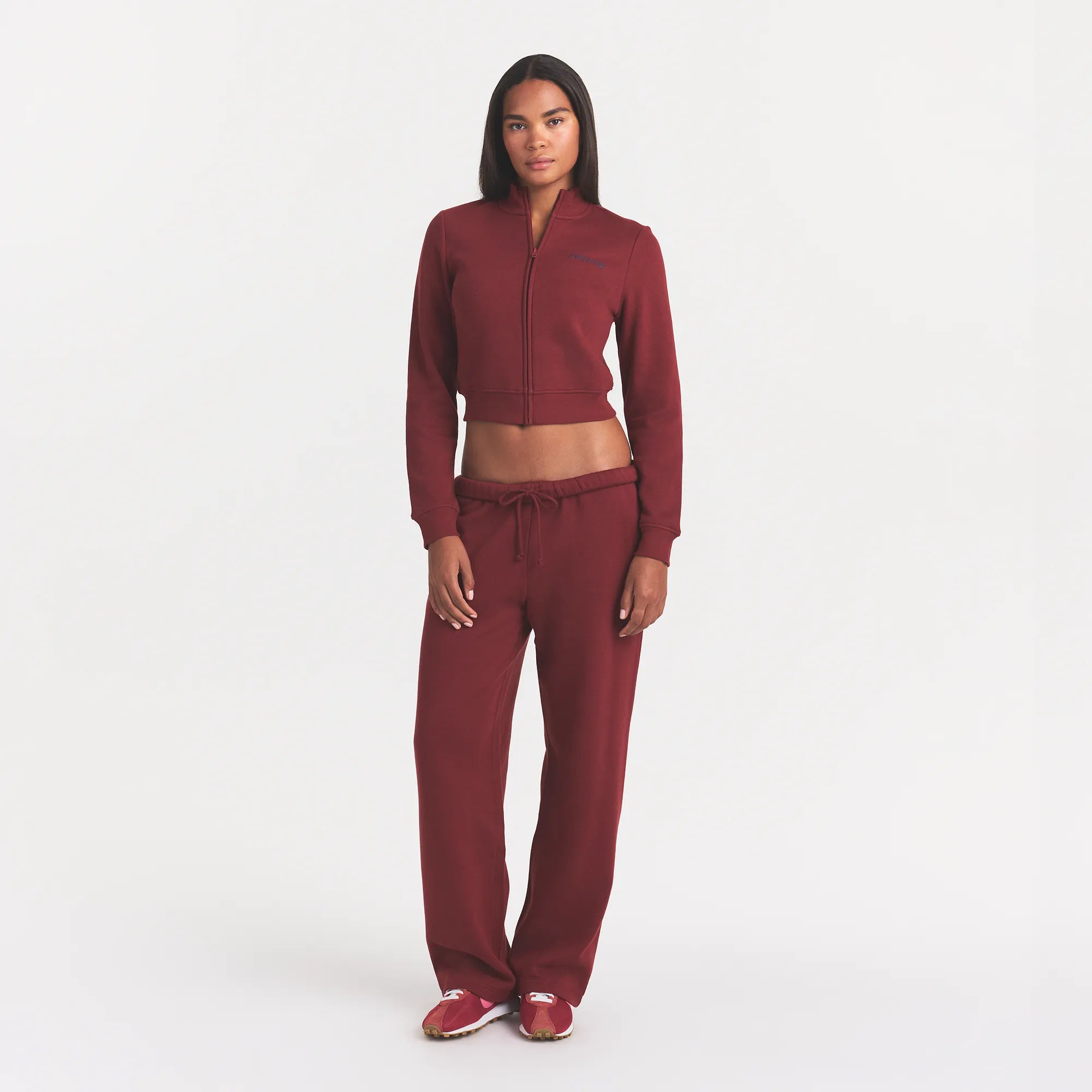 COTTON FLEECE LOGO TRACK JACKET | MERLOT ON A MODEL FRONT VIEW @ | FOCUS: 0.0, 1.0, 0.9