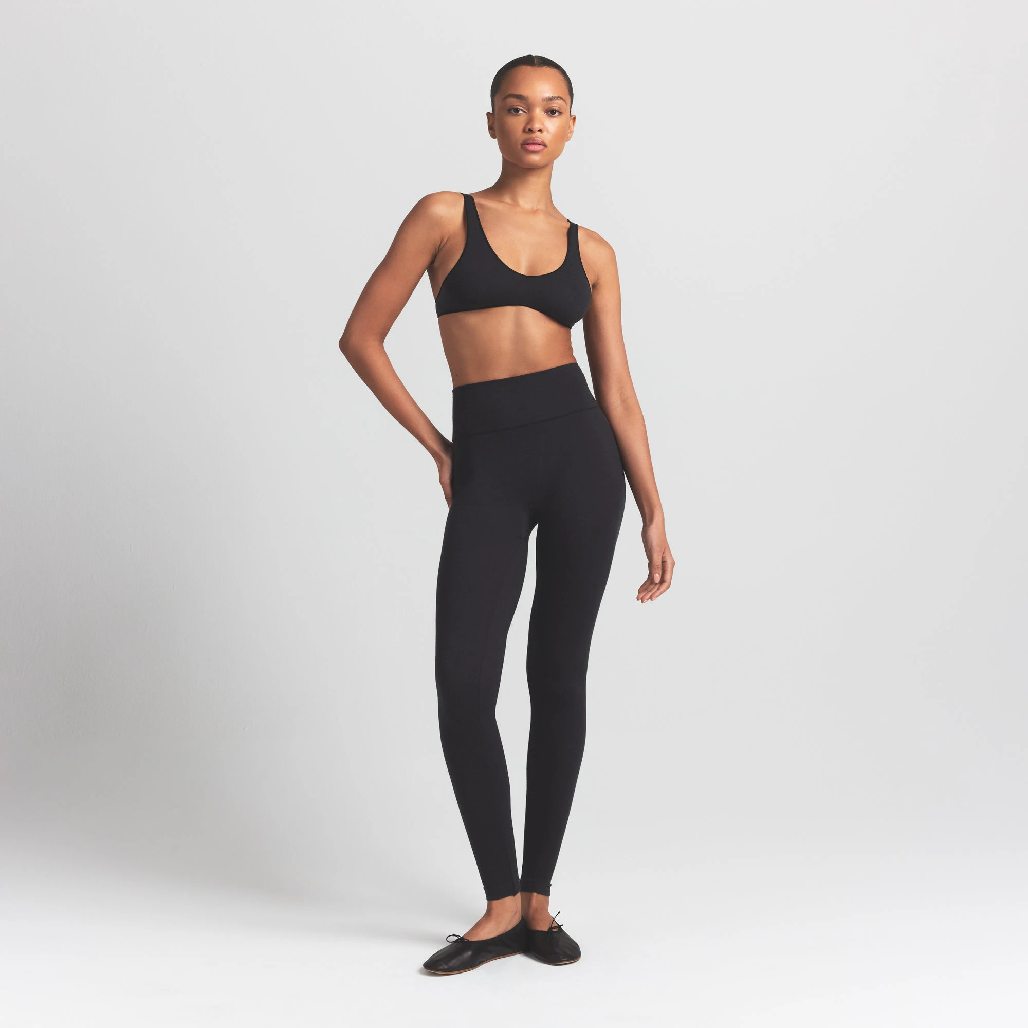 WOOL RIB BRALETTE | OBSIDIAN ON A MODEL FRONT VIEW S | FOCUS: 0.0, 1.0, 0.9