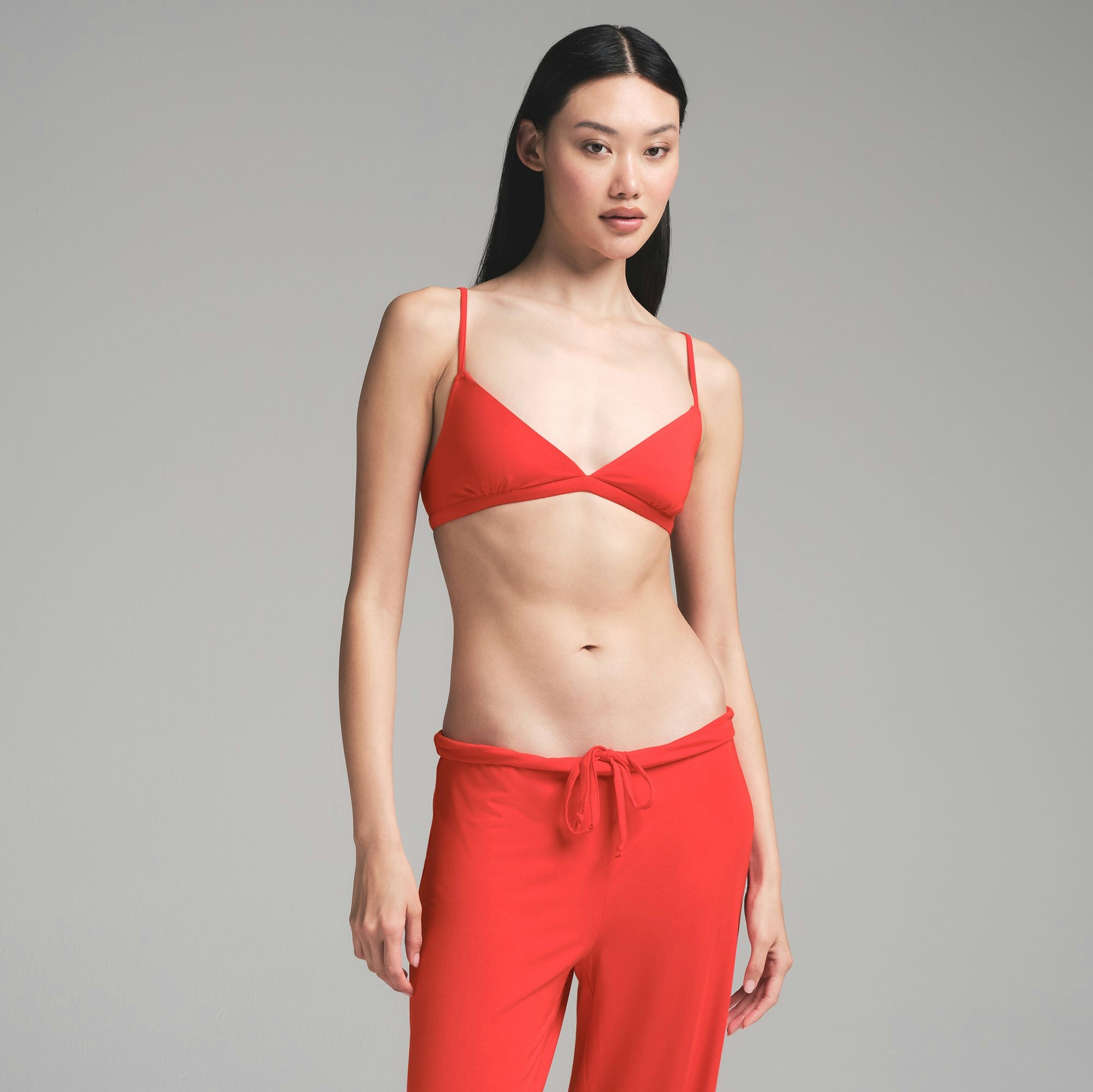 SKIMS SLEEP TRIANGLE BRALETTE | RUBY ON A MODEL FRONT VIEW | FOCUS: 0.0, 1.0, 0.9
