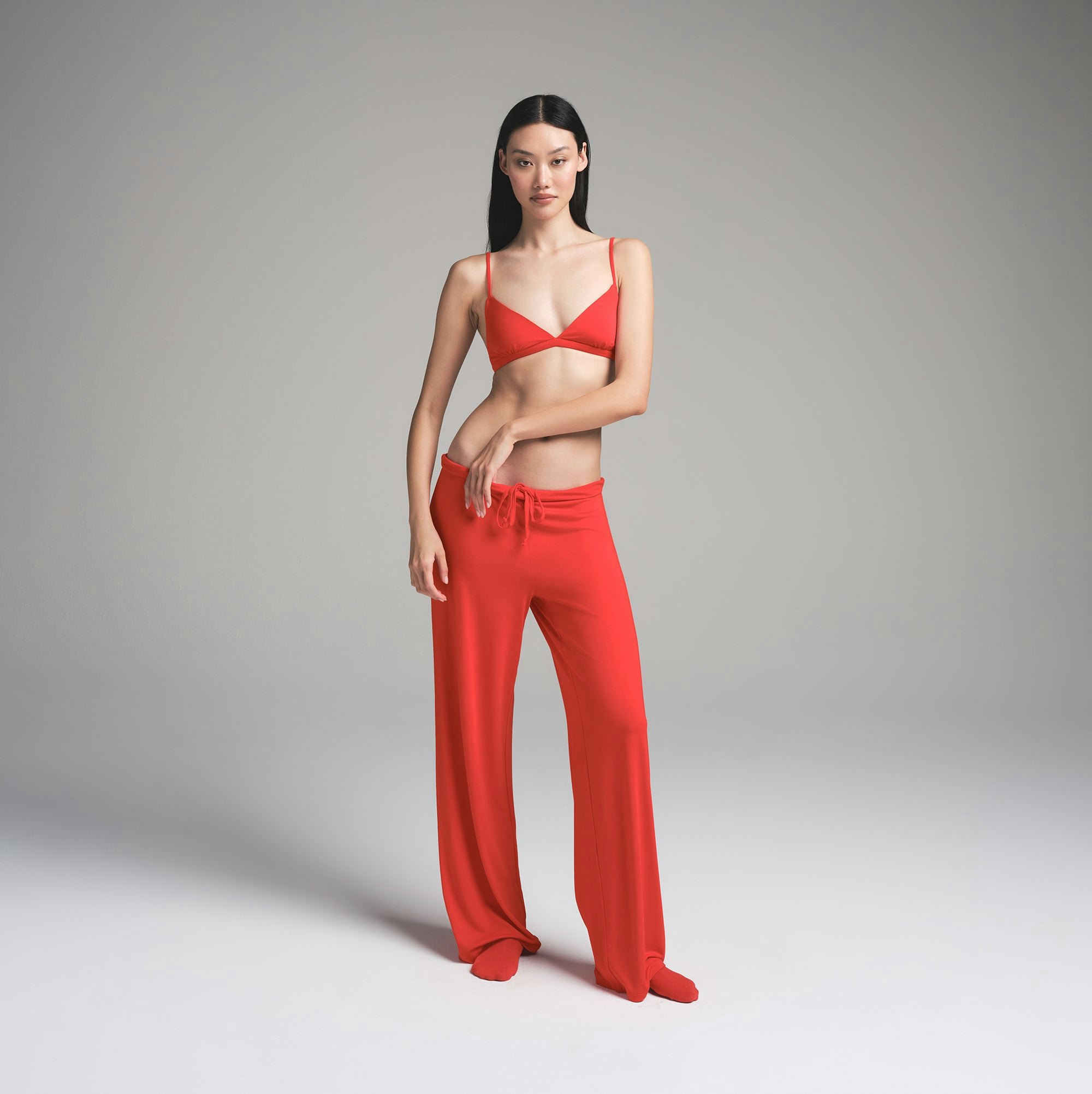 SKIMS SLEEP TRIANGLE BRALETTE | RUBY ON A MODEL FRONT VIEW | FOCUS: 0.0, 1.0, 0.9
