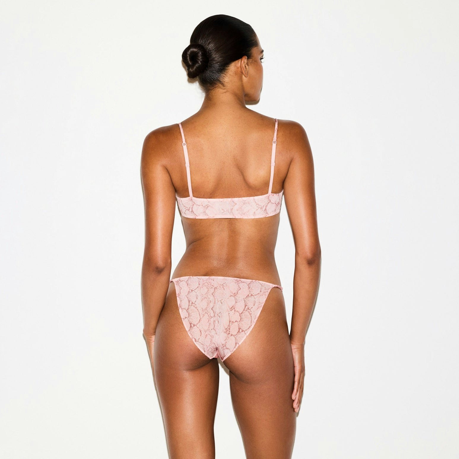MILKY SHEER FRONT CLOSE BRA | ROSE PASTEL SNAKE PRINT ON A MODEL SIDE VIEW